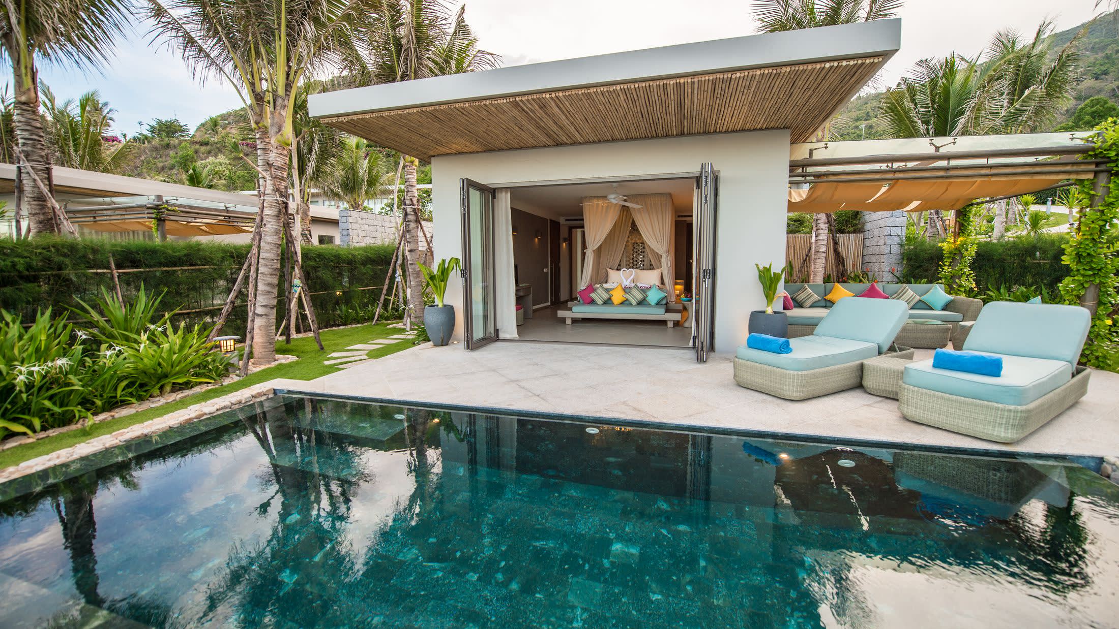 a person in a pool of water in front of a house