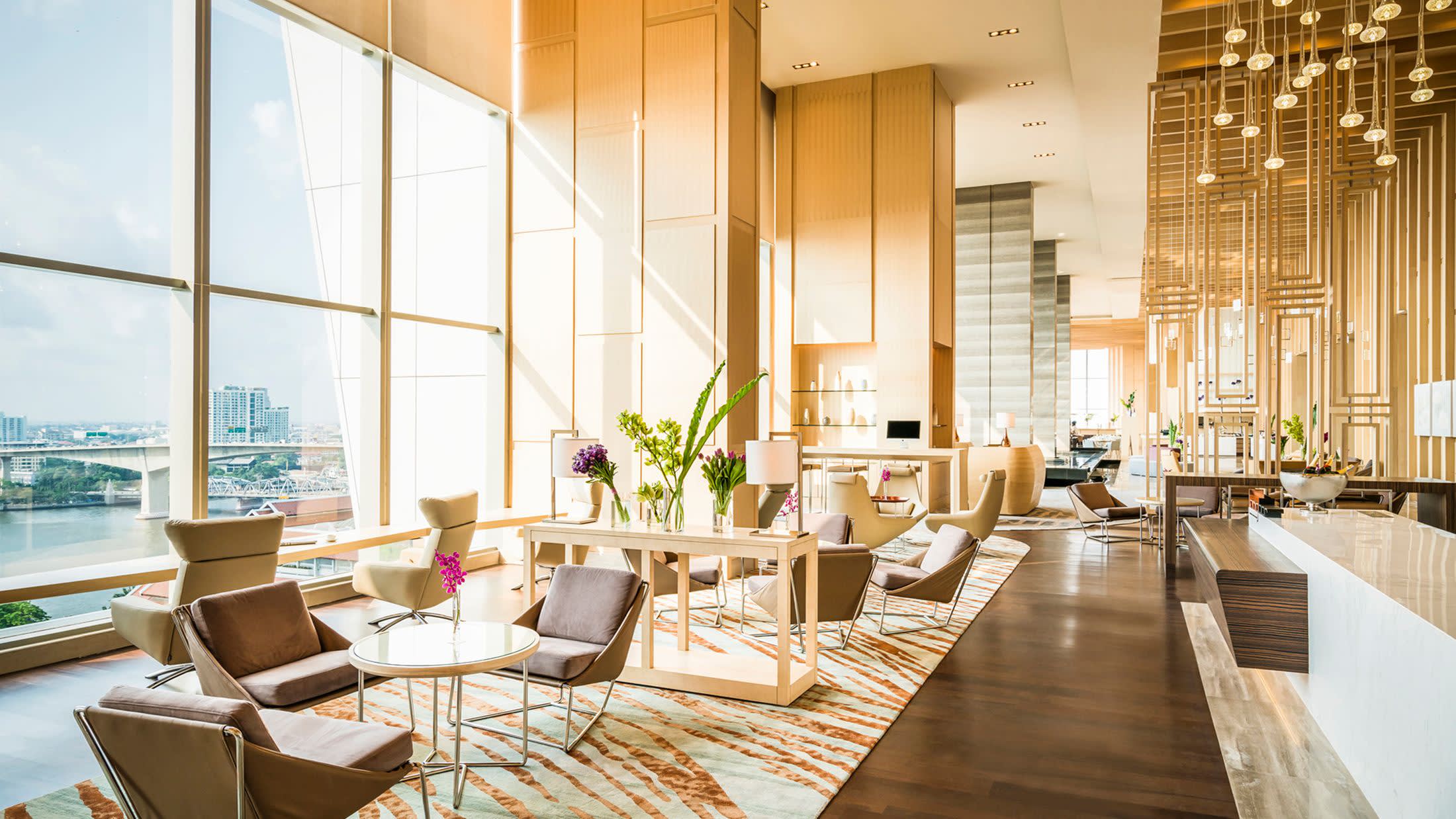 a living room filled with furniture and a large window