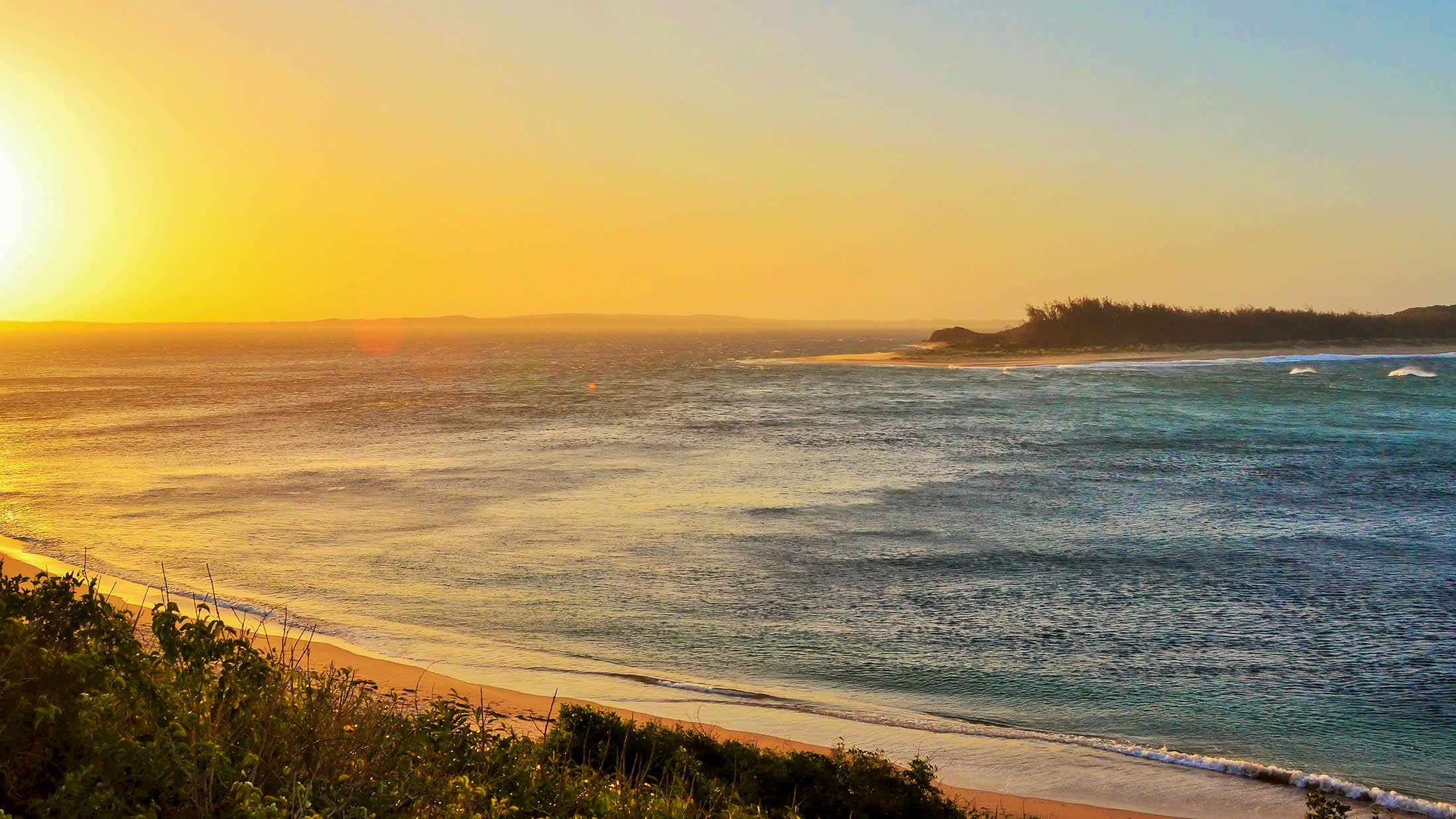a sunset over a body of water