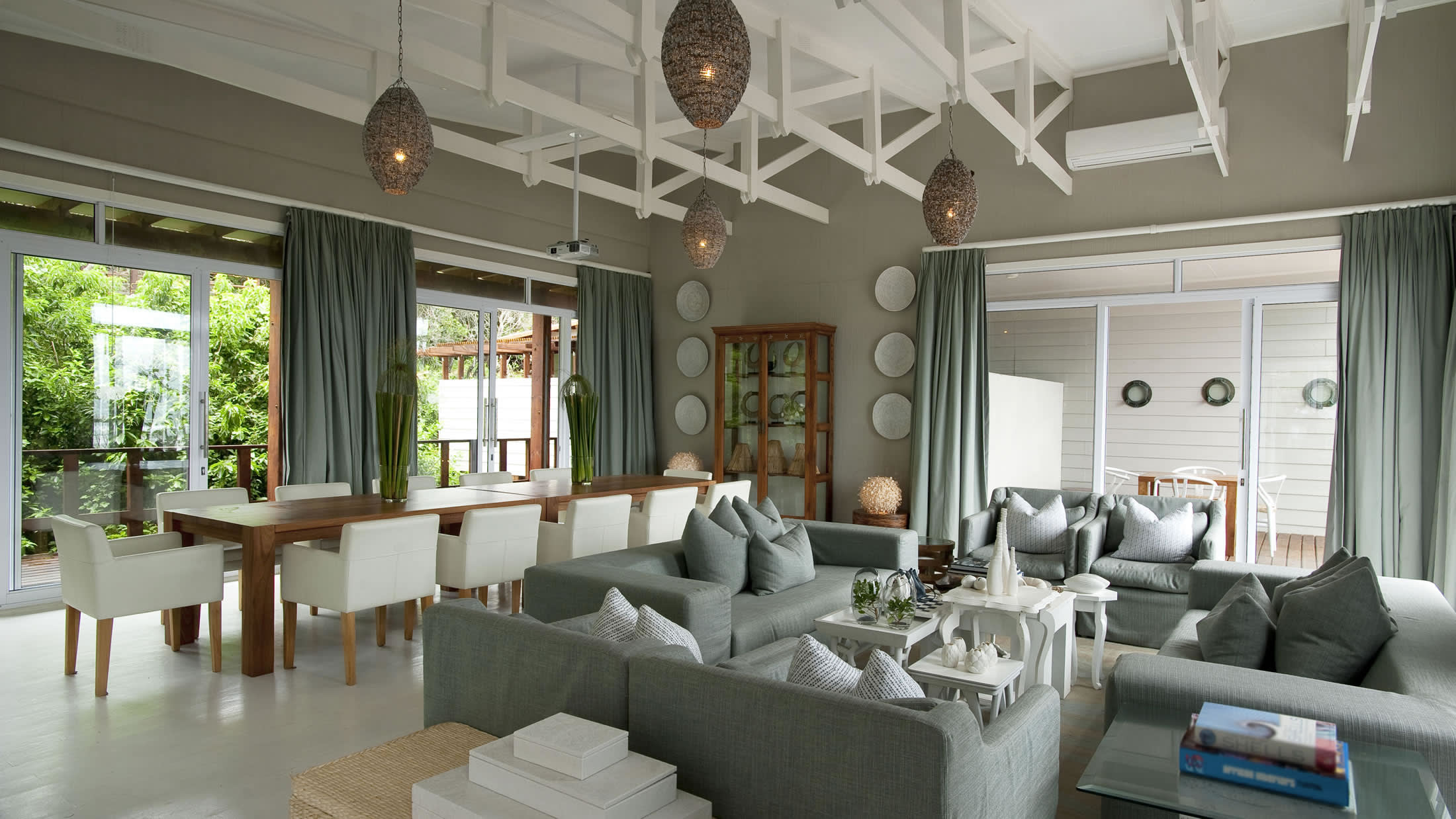 a living room filled with furniture and a large window