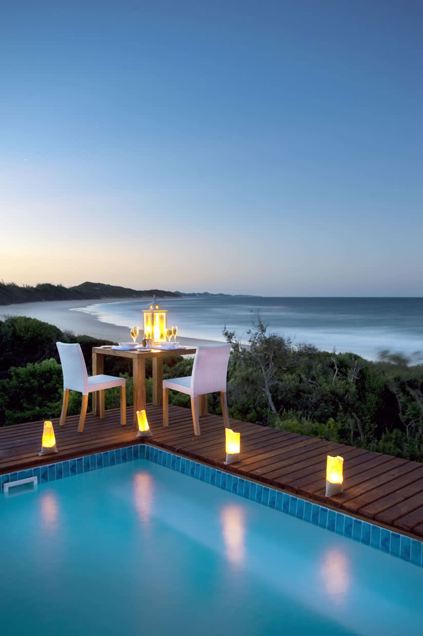 a view of a pier next to a body of water