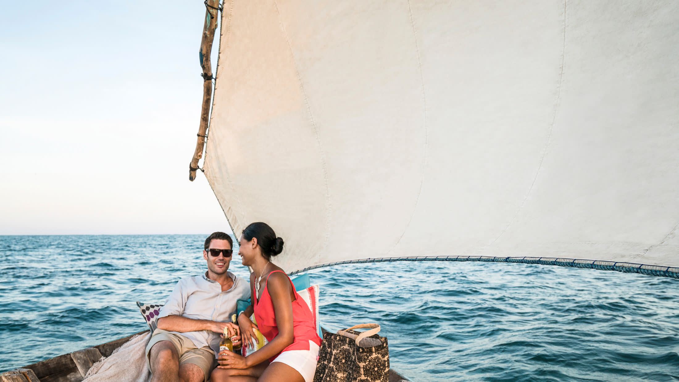 a person standing next to a body of water