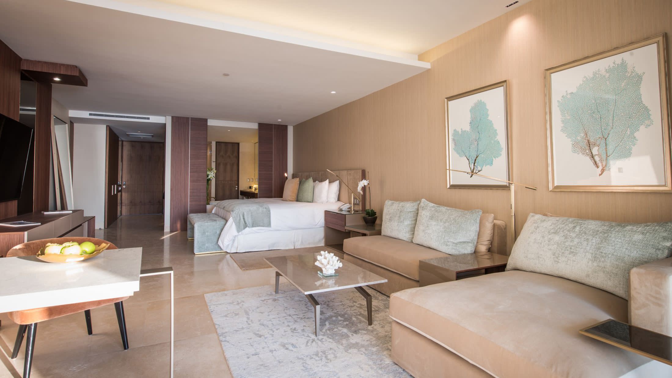 a living room filled with furniture and a large window