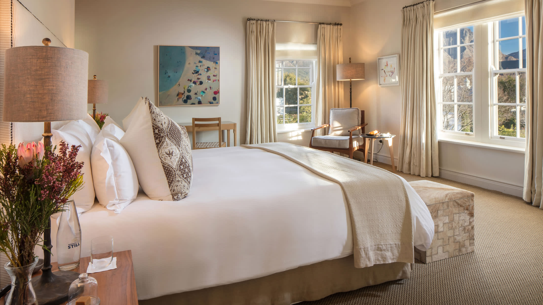 a hotel room with a bed and a window