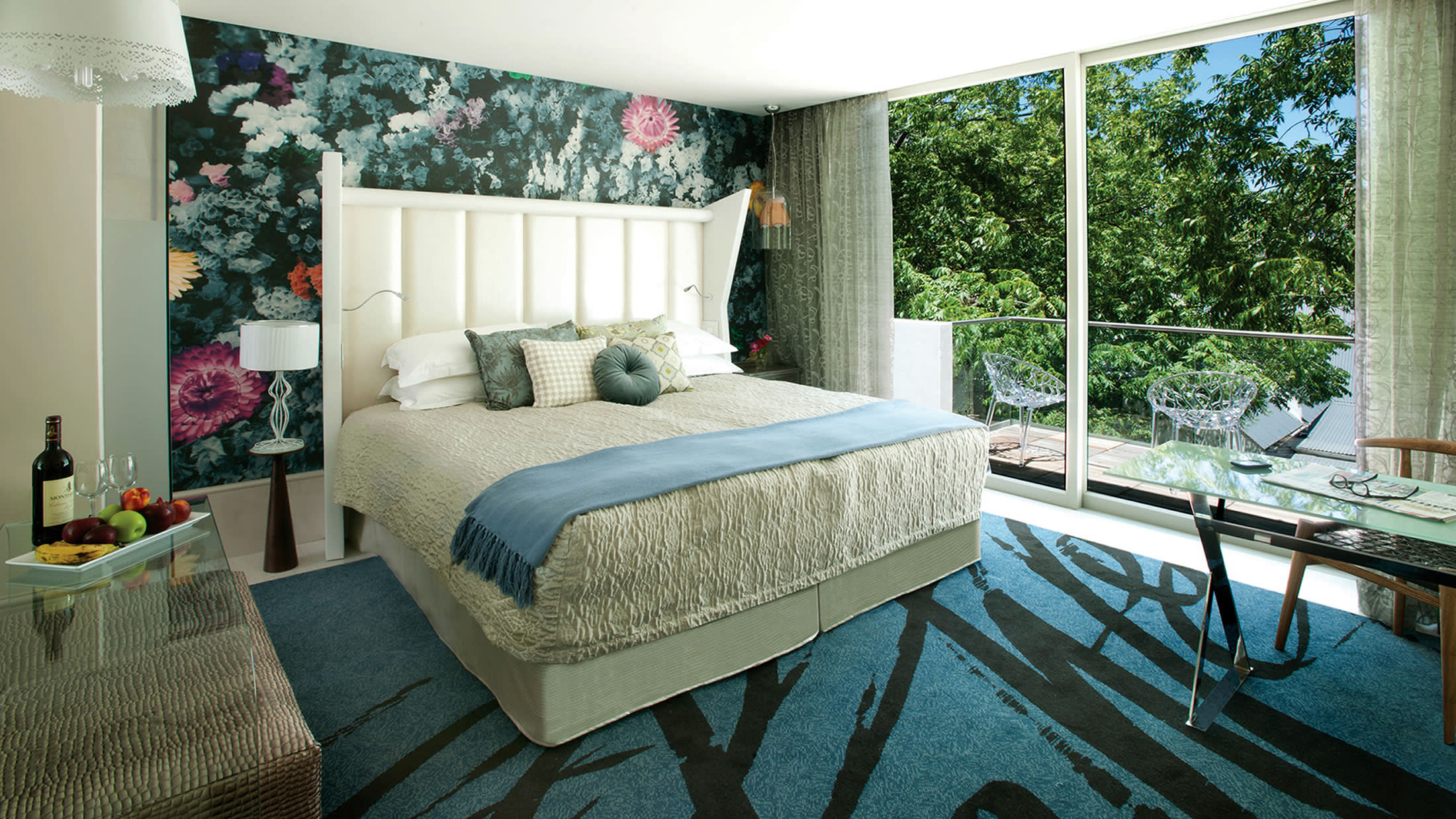 a living room filled with furniture and a large window