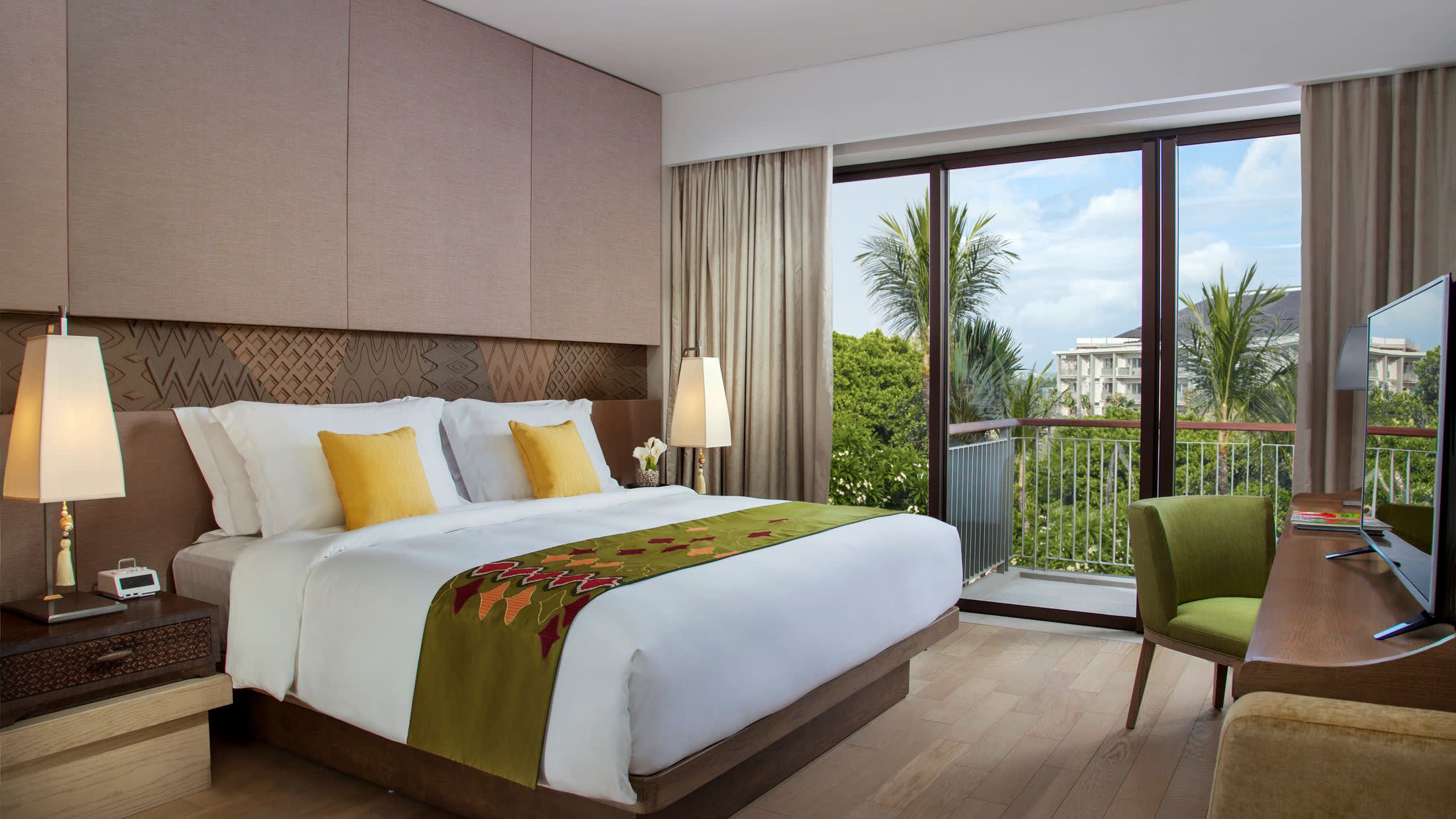 a bedroom with a large bed in a hotel room