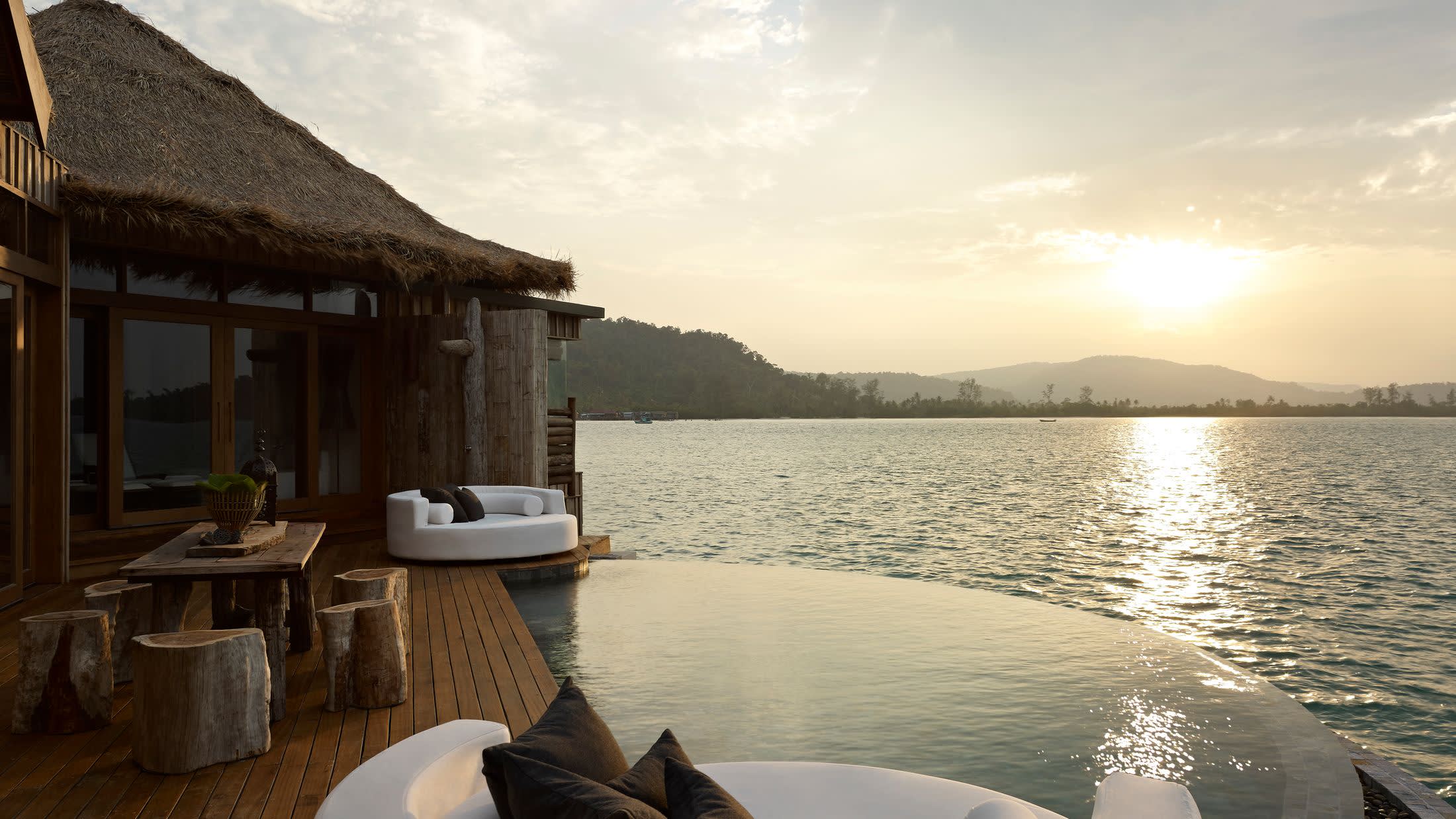 a chair sitting in front of a body of water