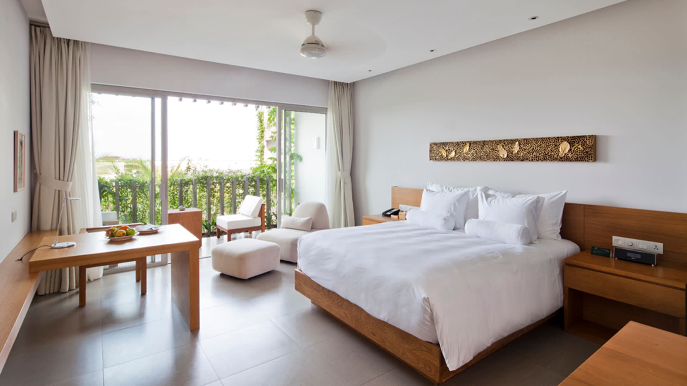 a bedroom with a large bed in a room