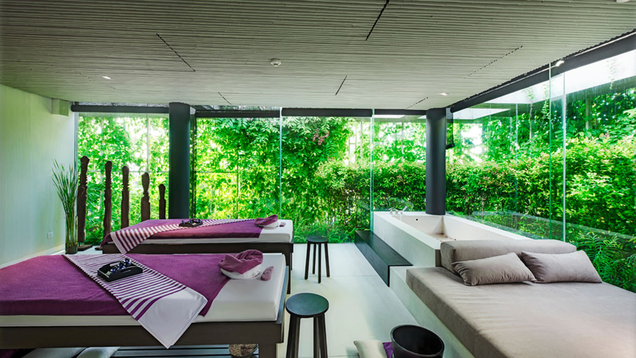 a living room filled with furniture and a large window