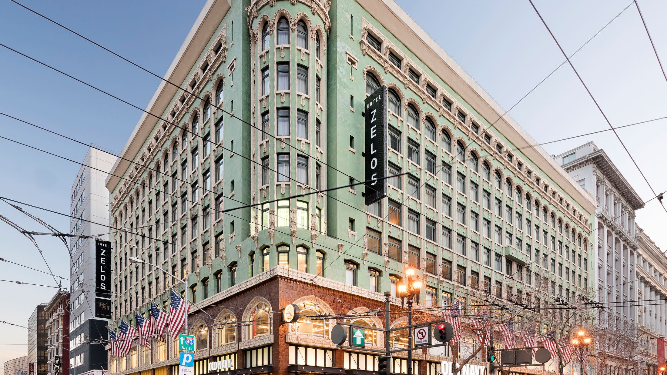 a group of people walking on a city street