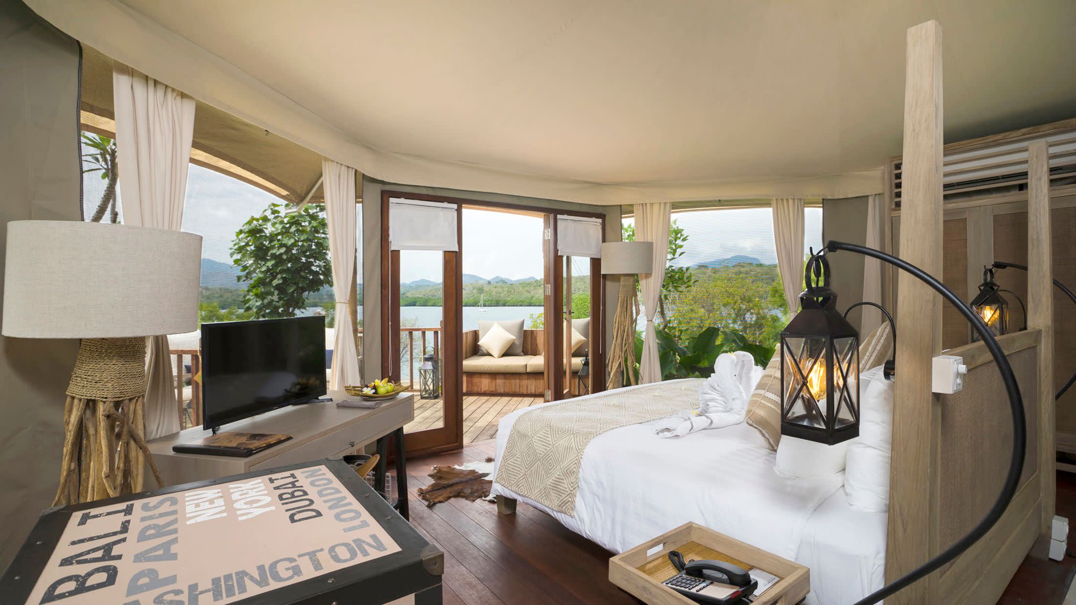 a living room filled with furniture and a large window