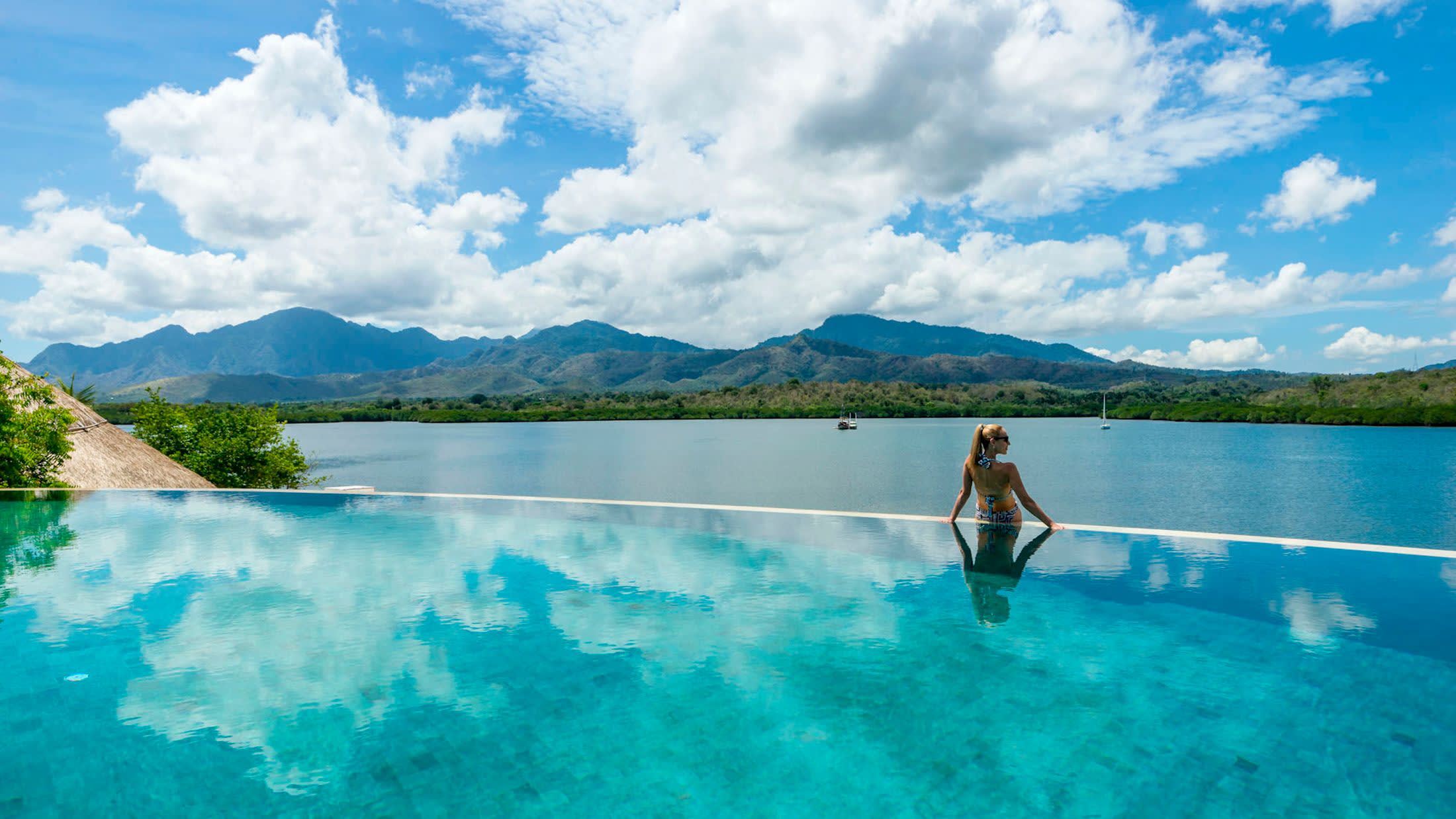a man riding a wave on top of a body of water