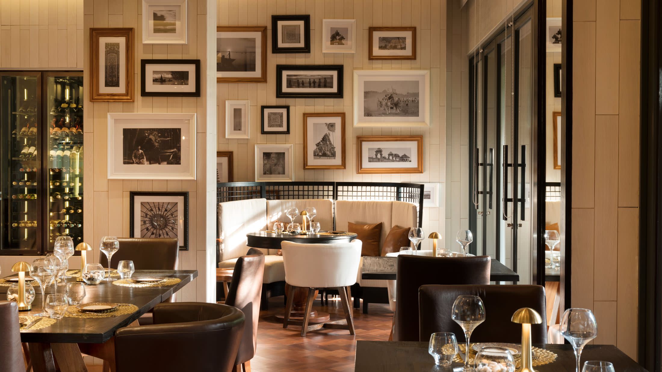 a room filled with furniture and vase on a table