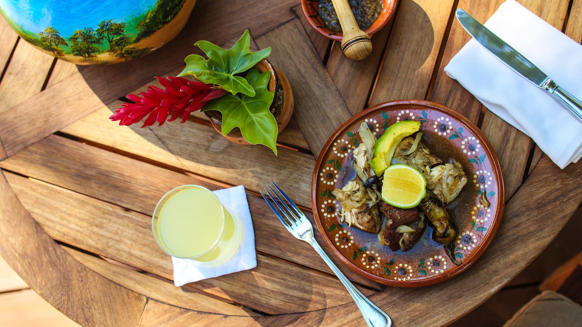 a plate of food sitting on top of a wooden table