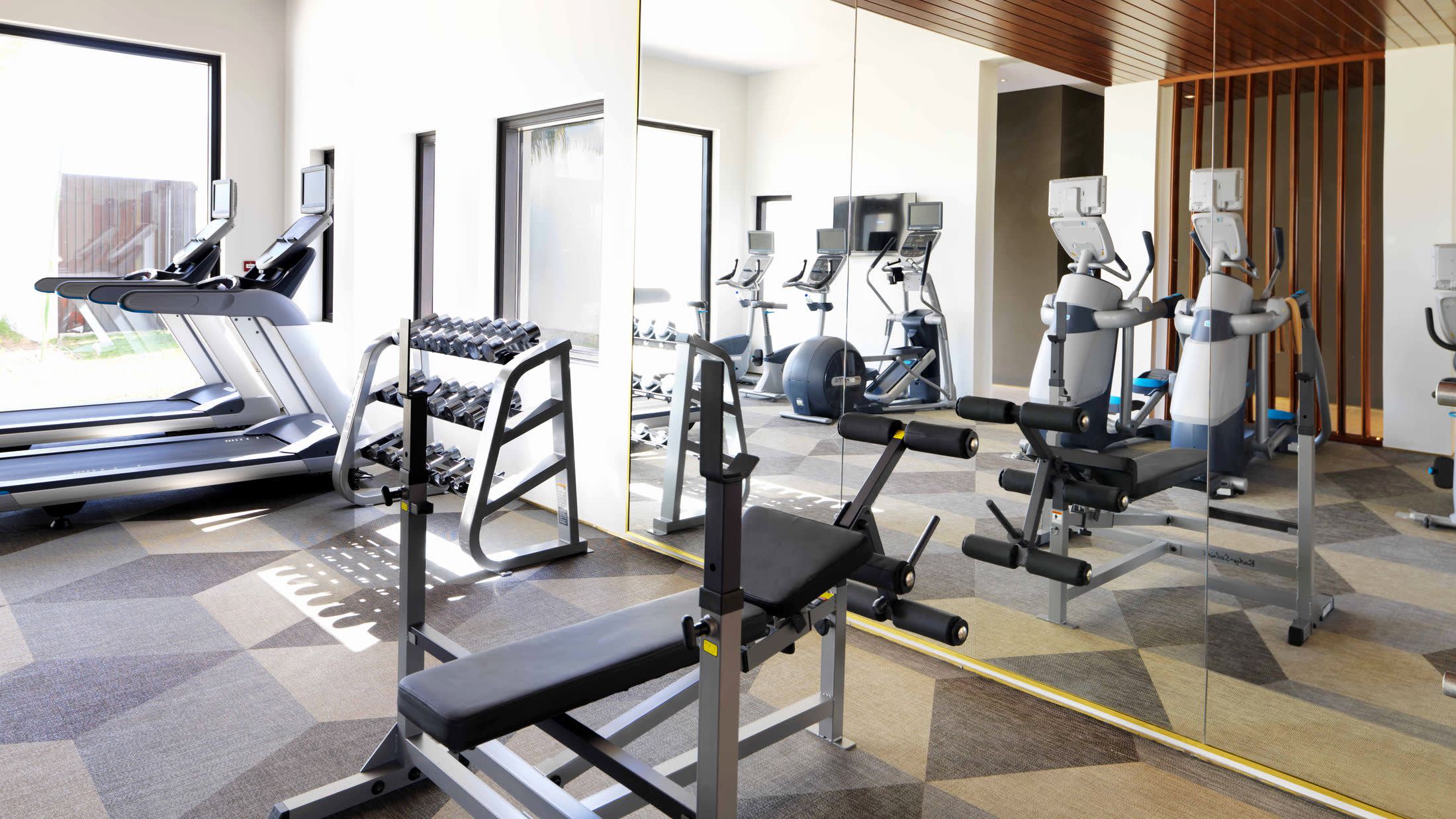 a living room filled with furniture and a large window