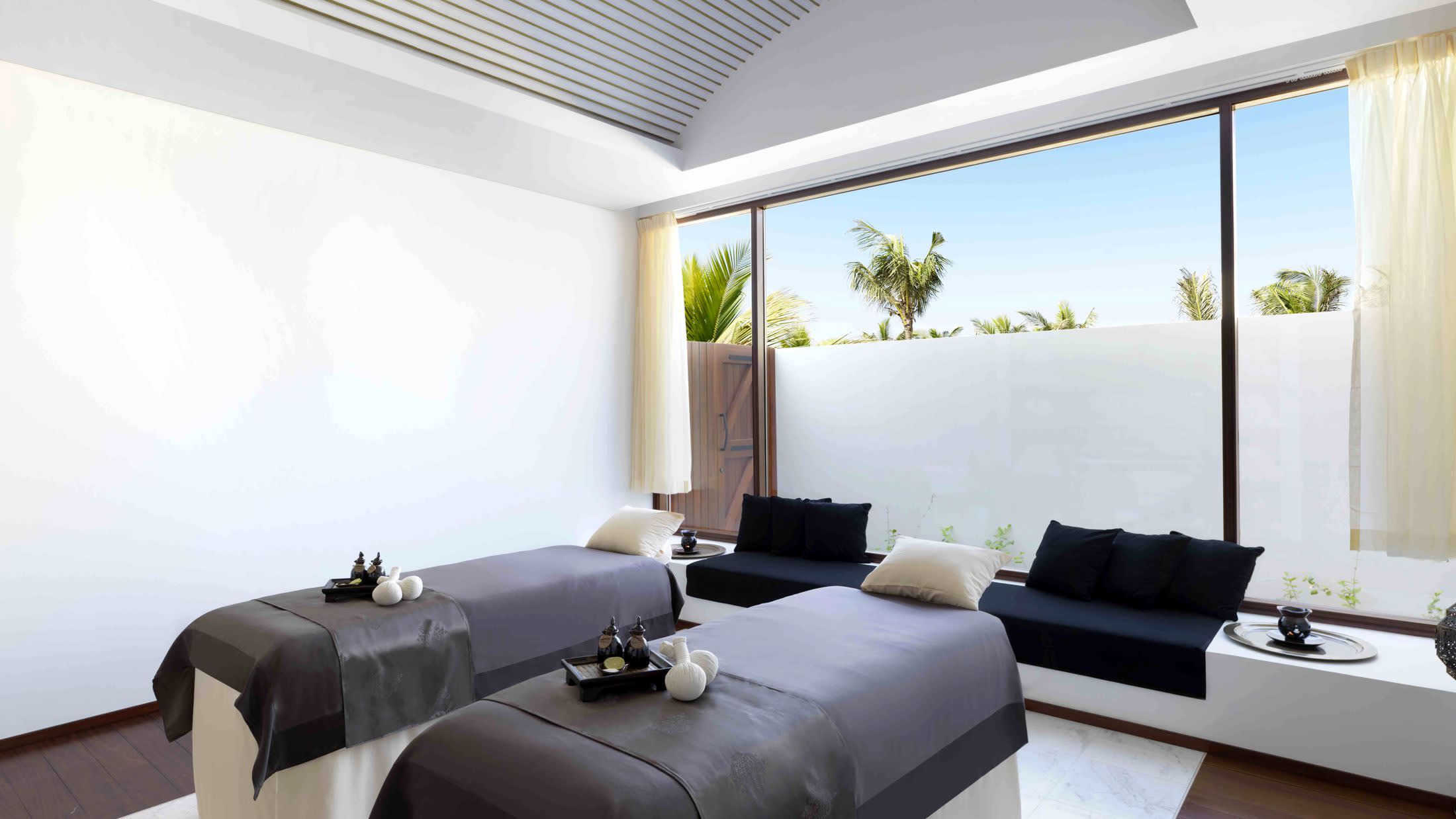 a living room filled with furniture and a large window