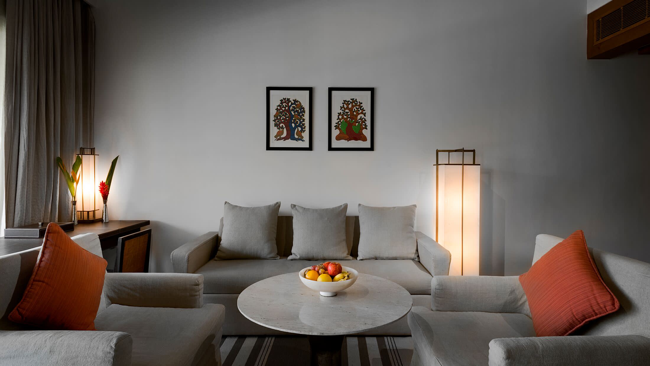 a large red chair in the living room