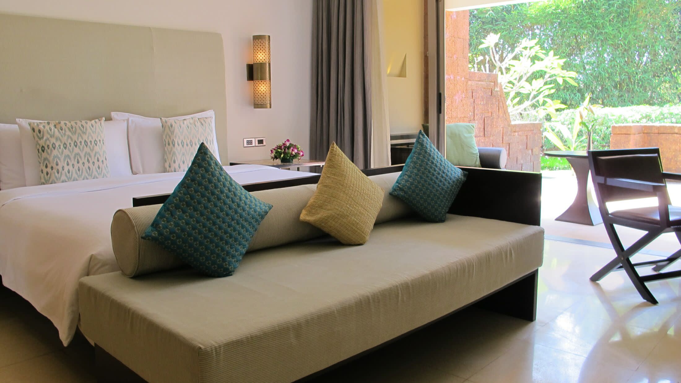 a hotel room with a couch and a table