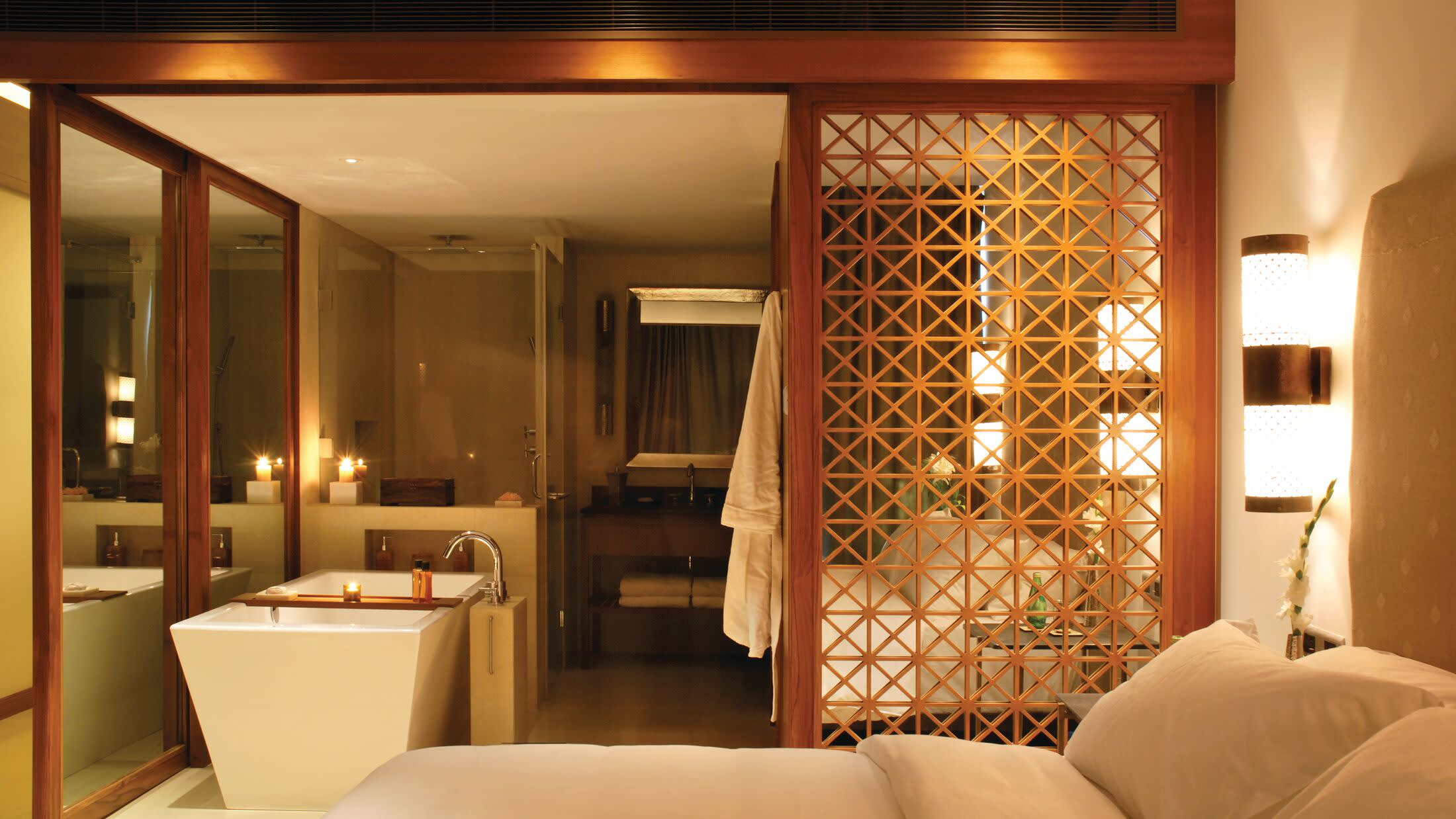 a bedroom with a bed and a mirror