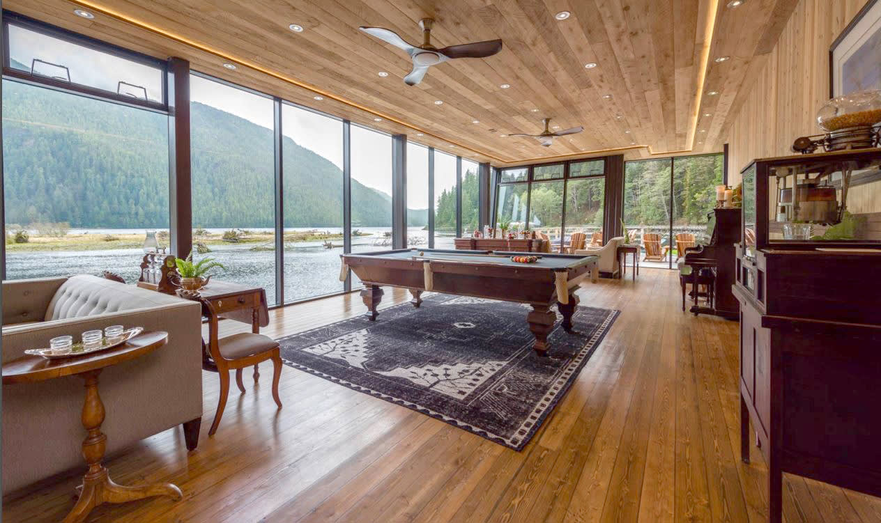 a living room filled with furniture and a large window