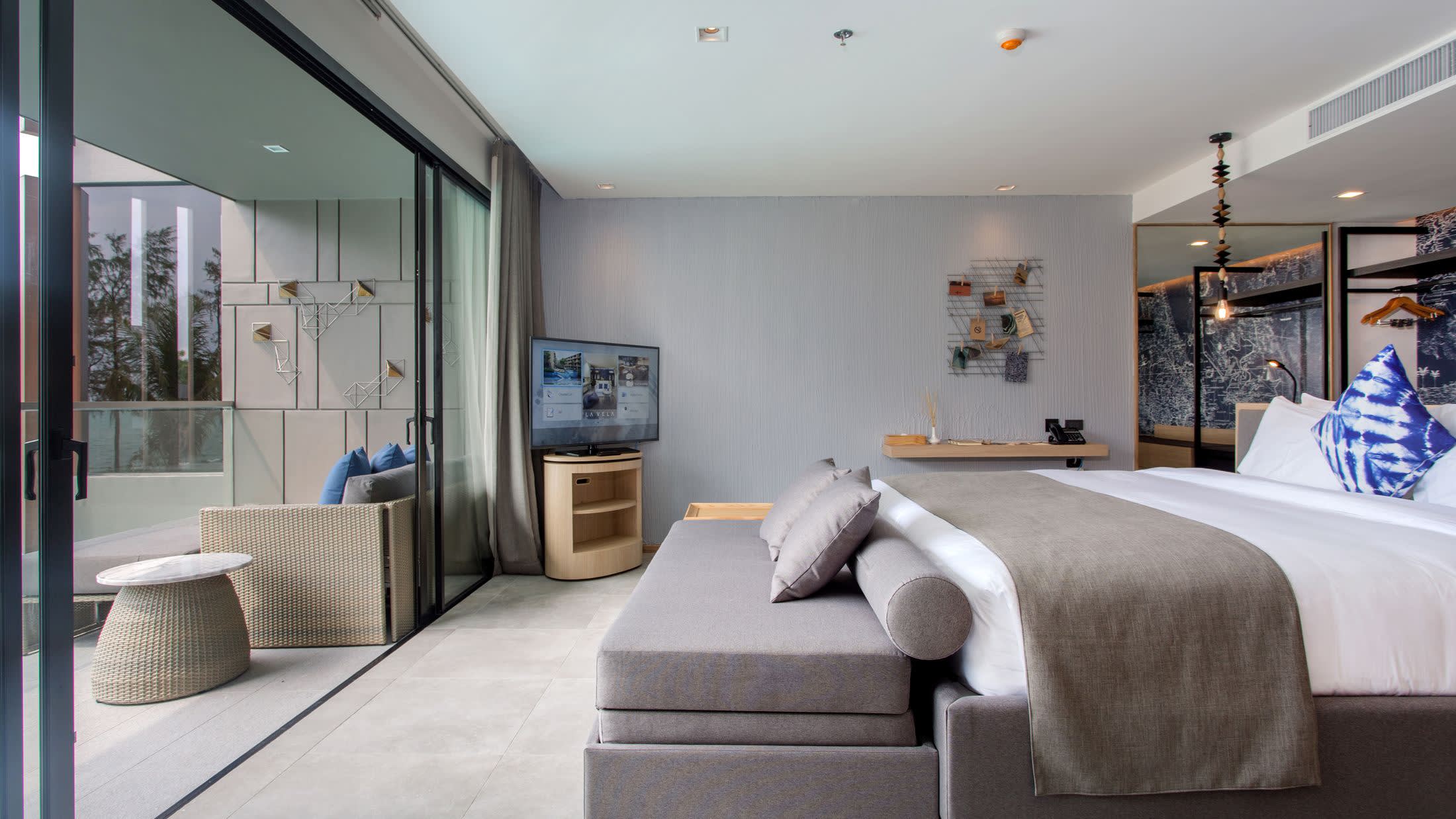 a bedroom with a view of a living room