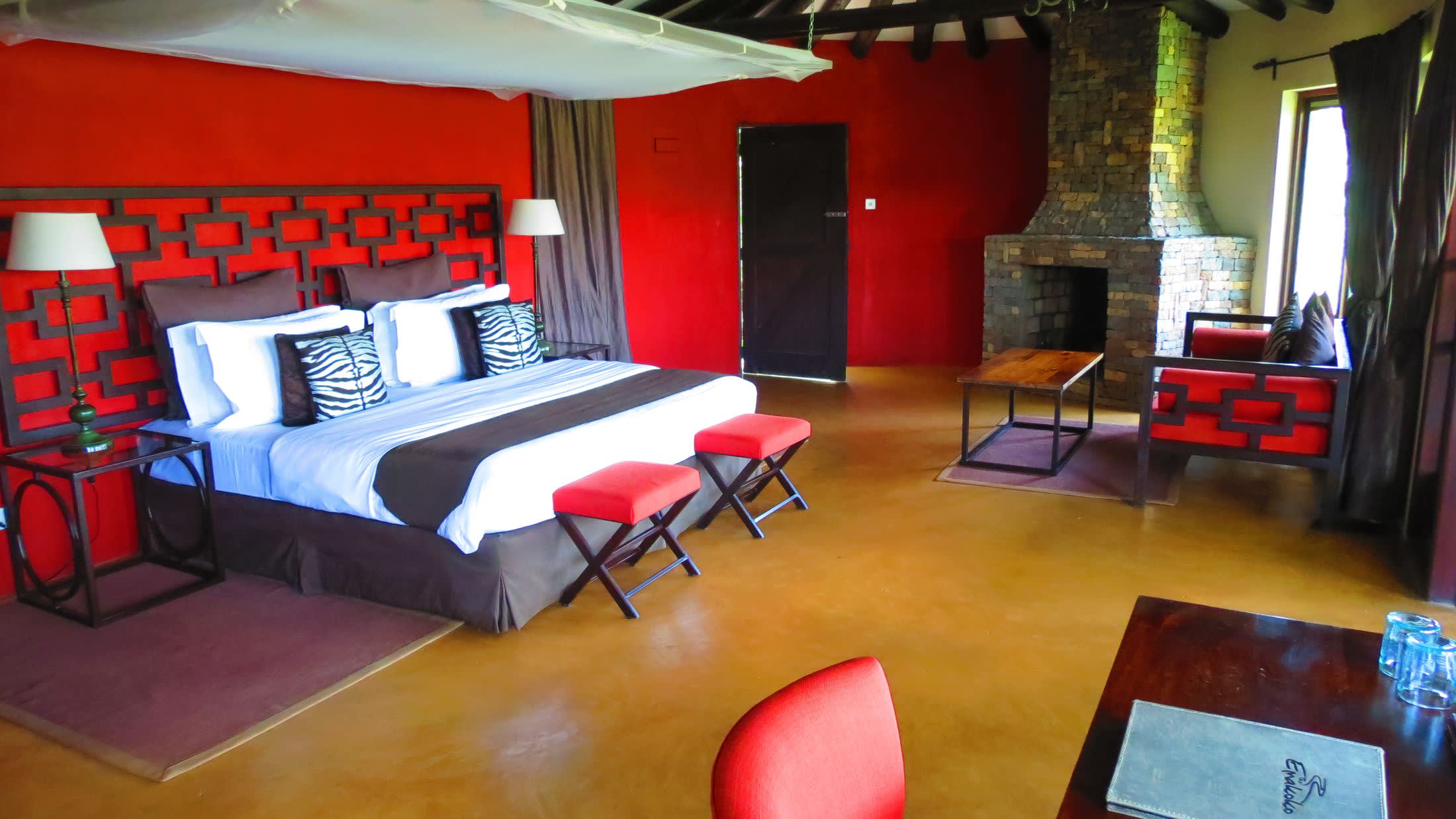 a living room filled with furniture and a red rug