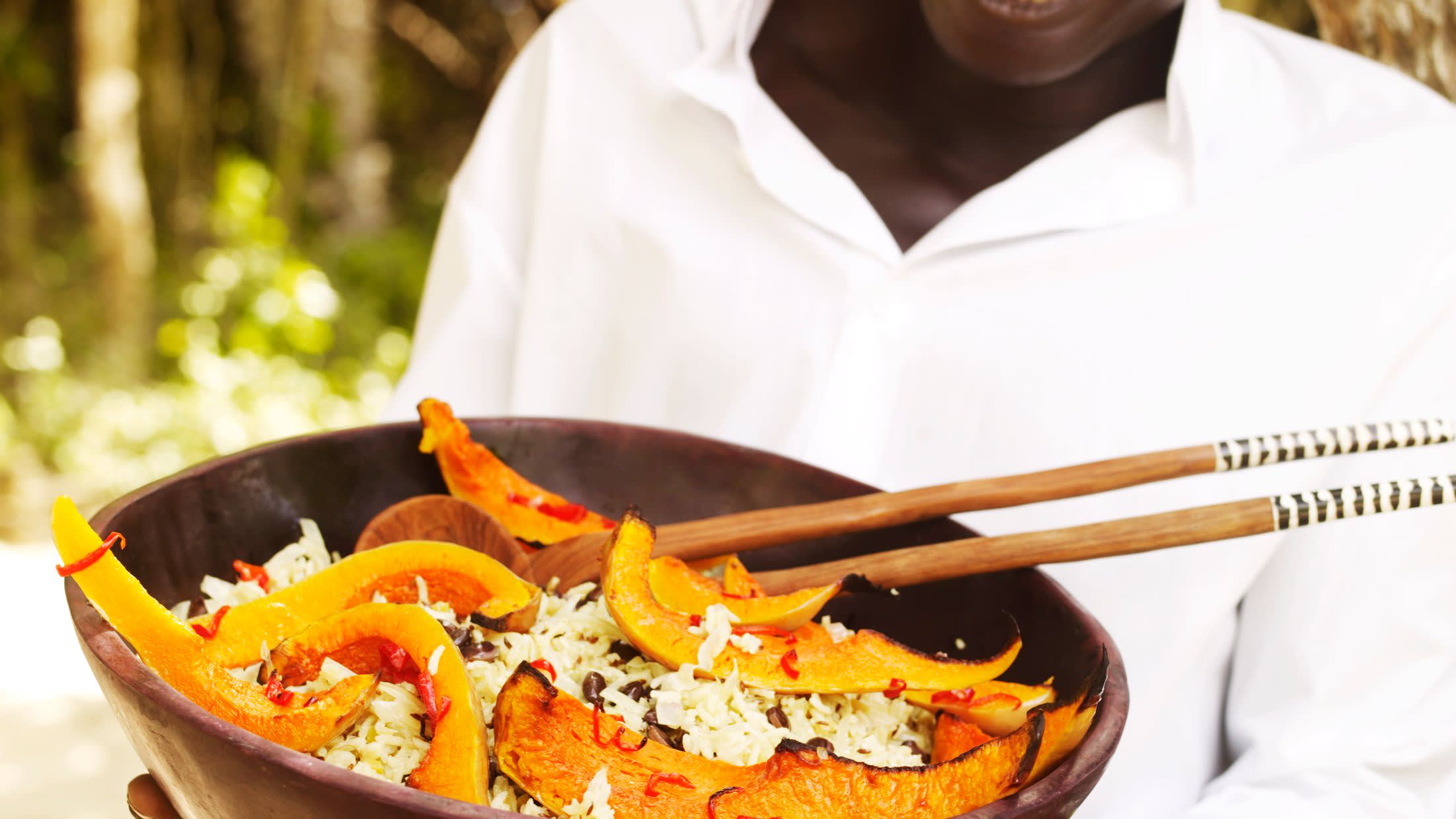 a person holding a plate of food