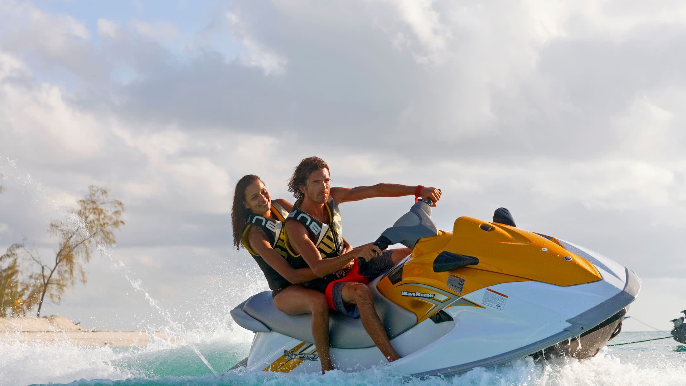 a person riding a surf board on a body of water
