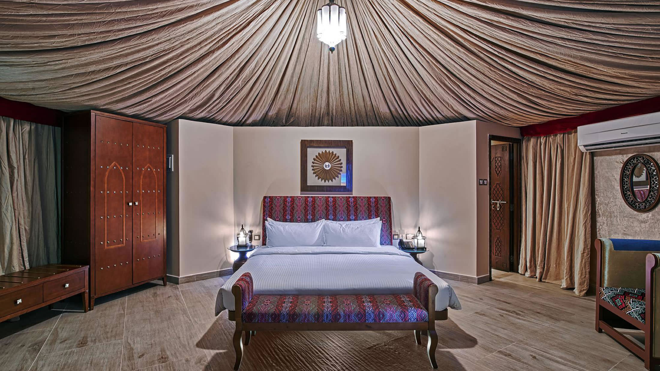 a bedroom with a large bed in a room