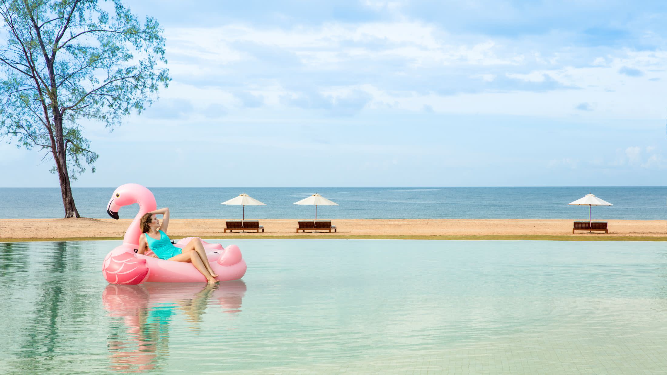 a person standing next to a body of water