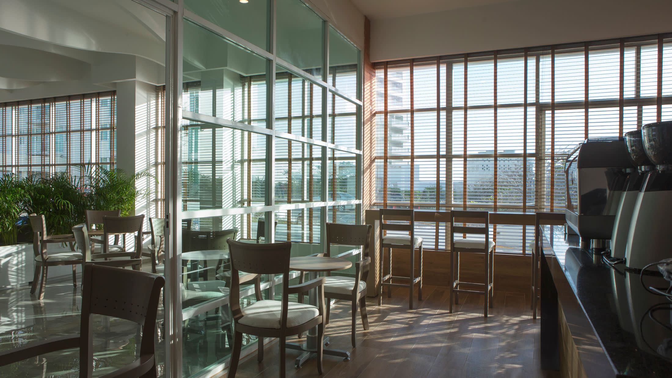 a living room filled with furniture and a large window