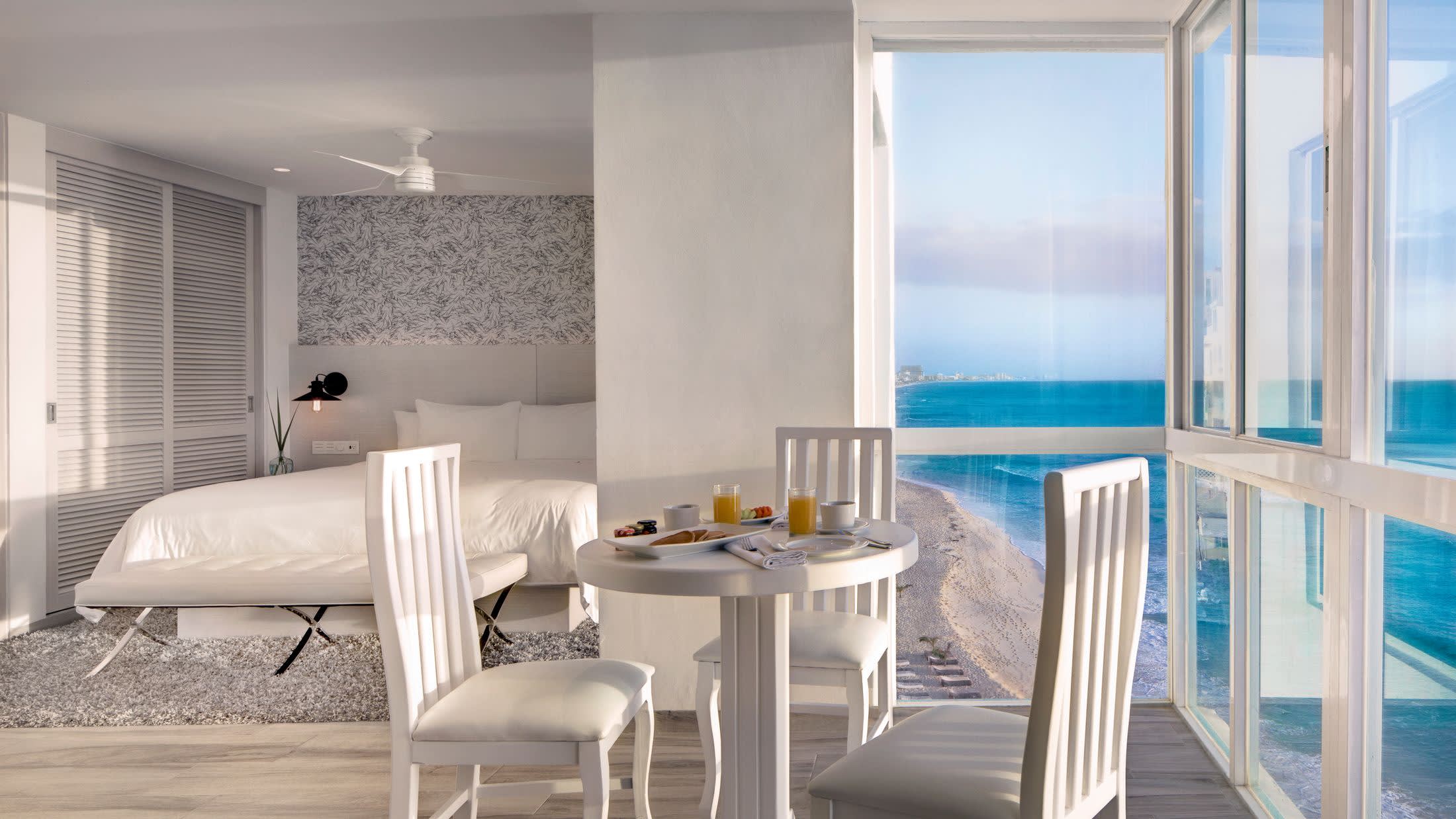 a dining room table in front of a window