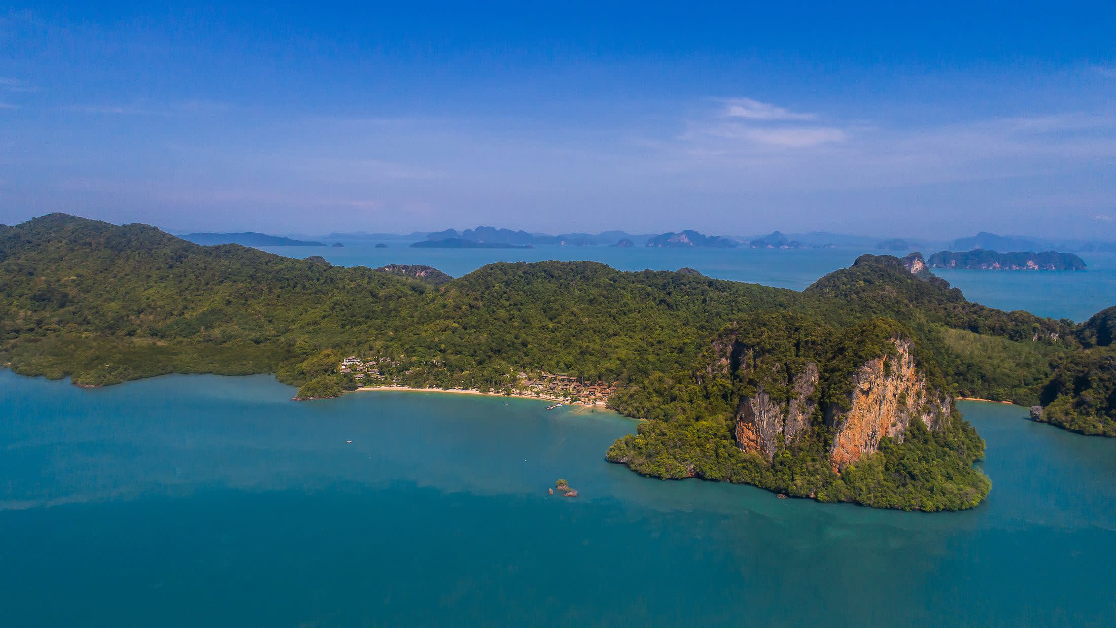 a body of water with a mountain in the background