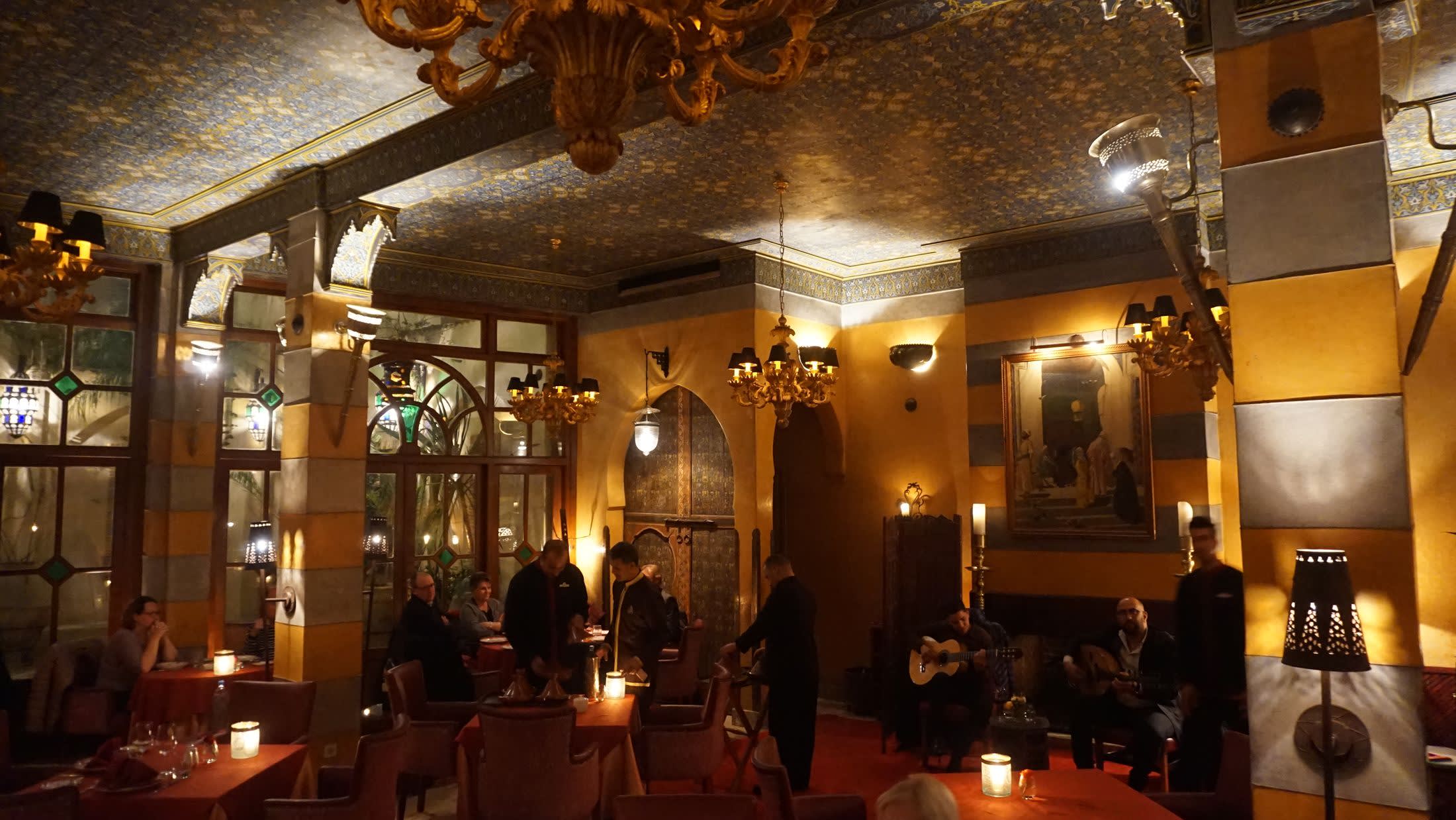 a group of people sitting at a table in a restaurant
