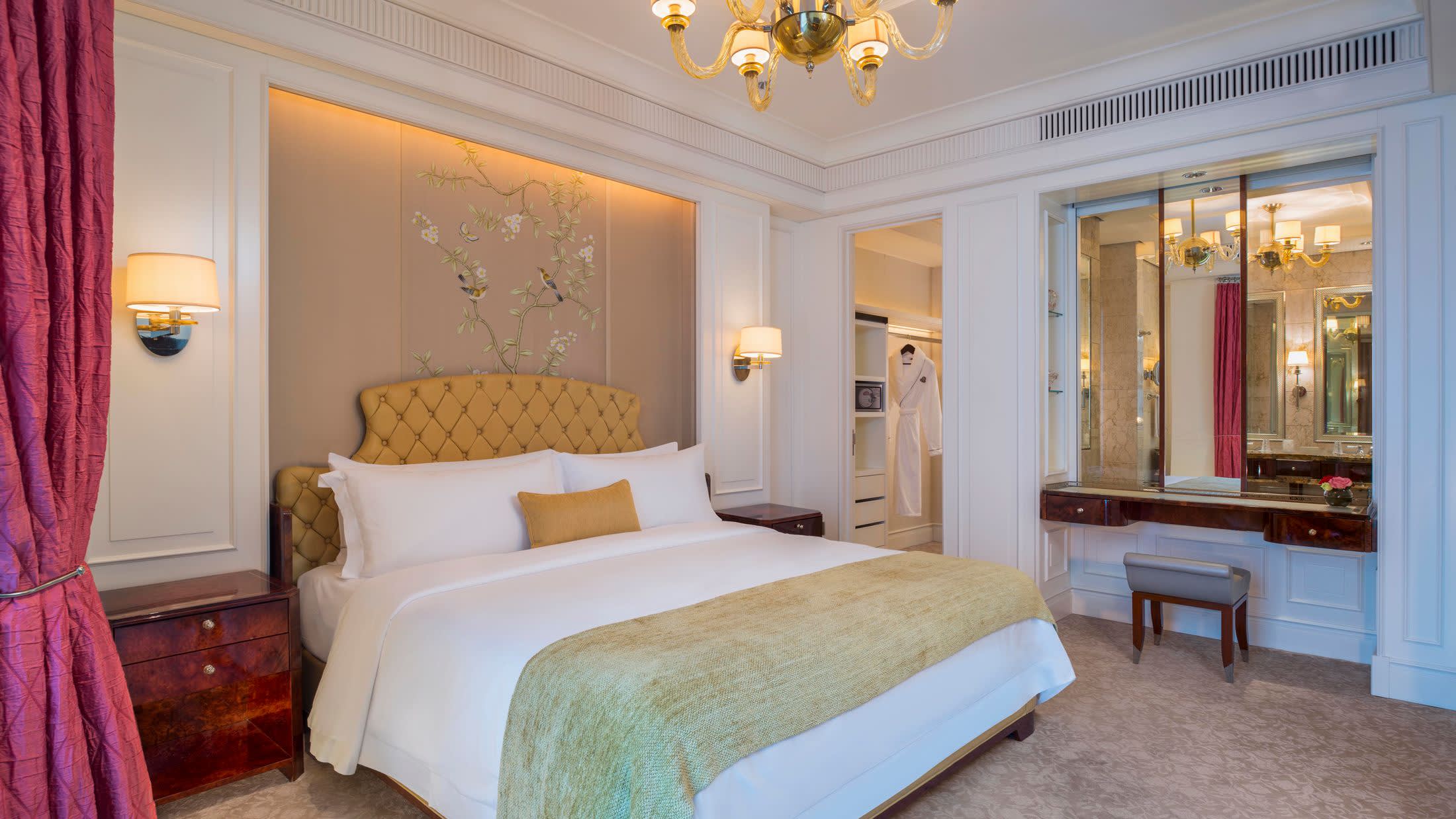 a bedroom with a bed in a room