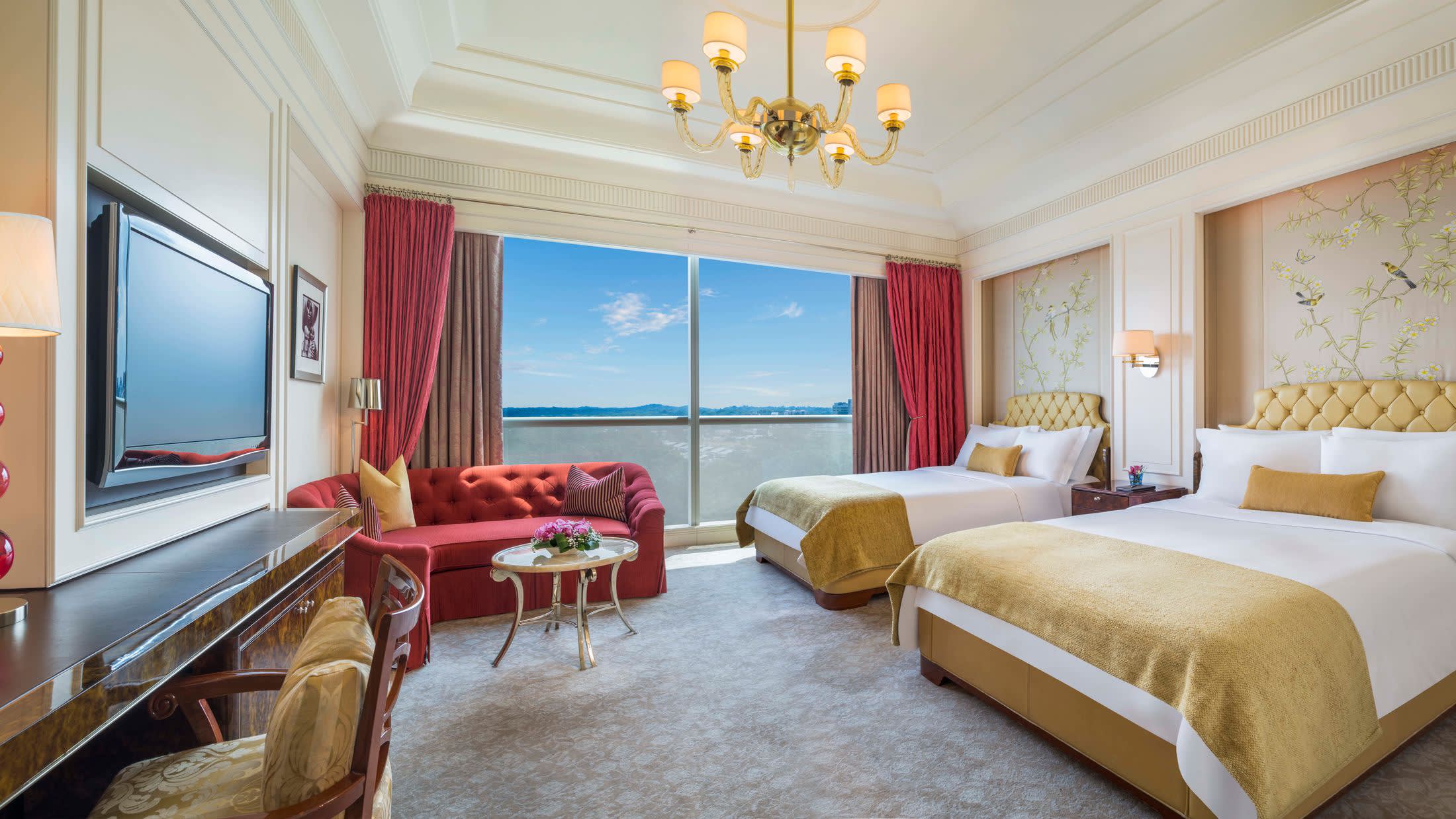 a bedroom with a bed and desk in a room