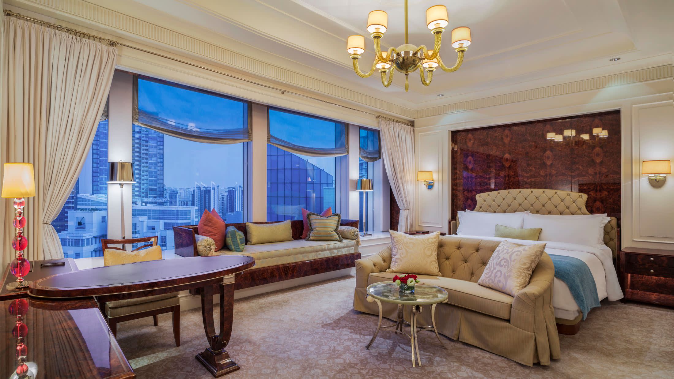 a living room filled with furniture and a large window