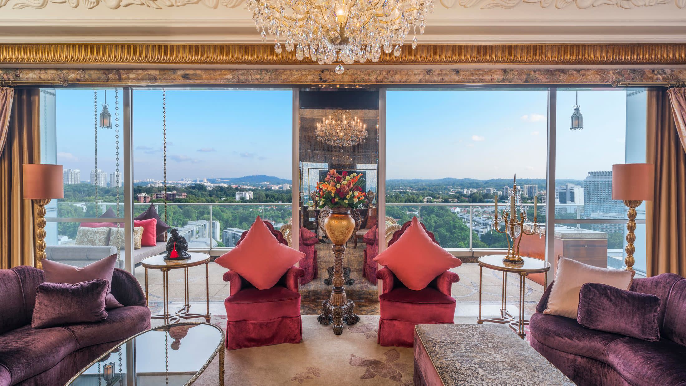 a view of a living room filled with furniture and a large window