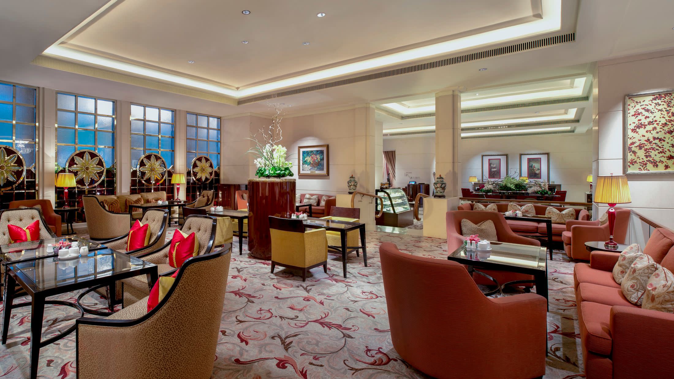 a living room filled with furniture and a large window