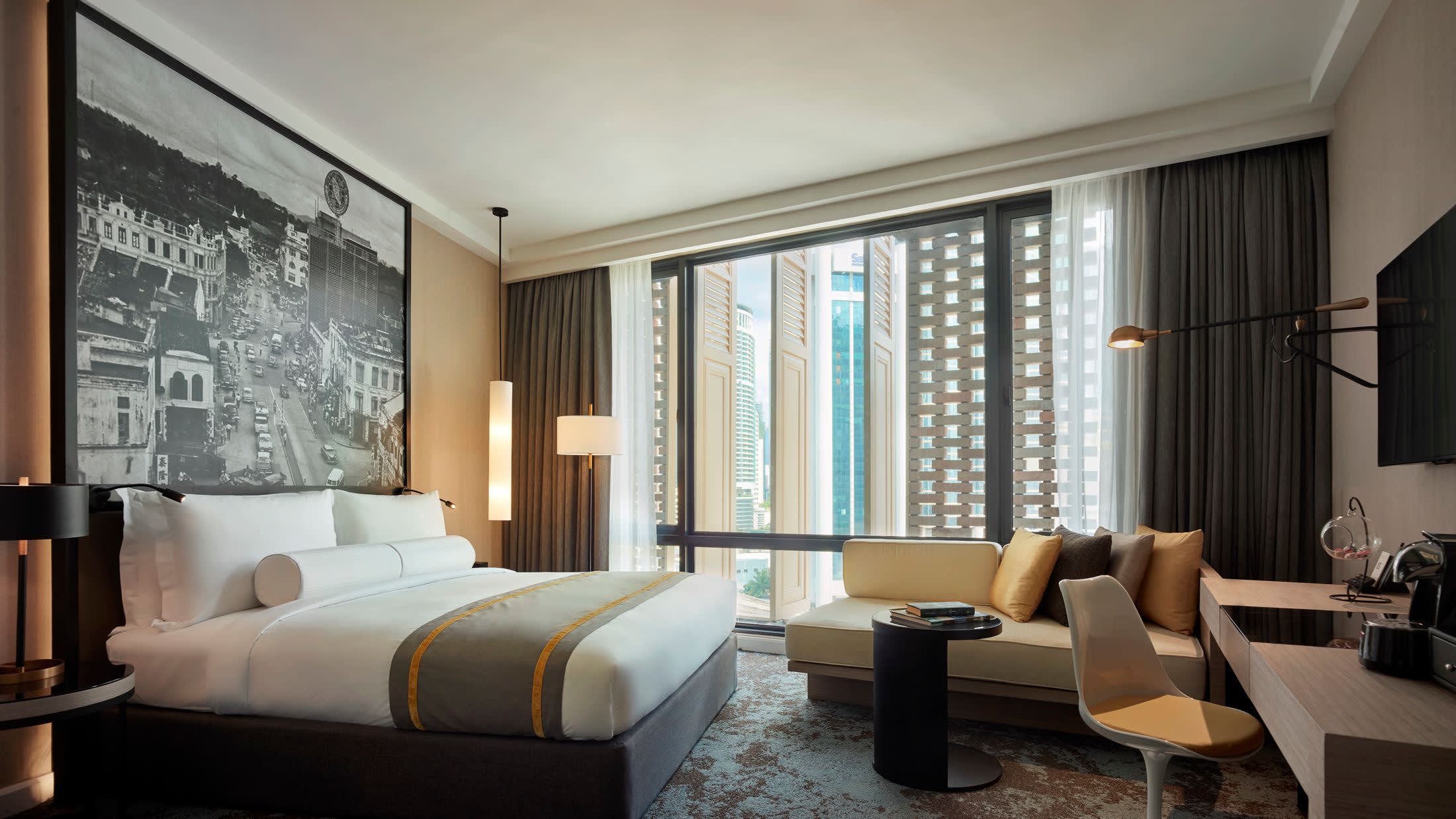 a living room filled with furniture and a large window