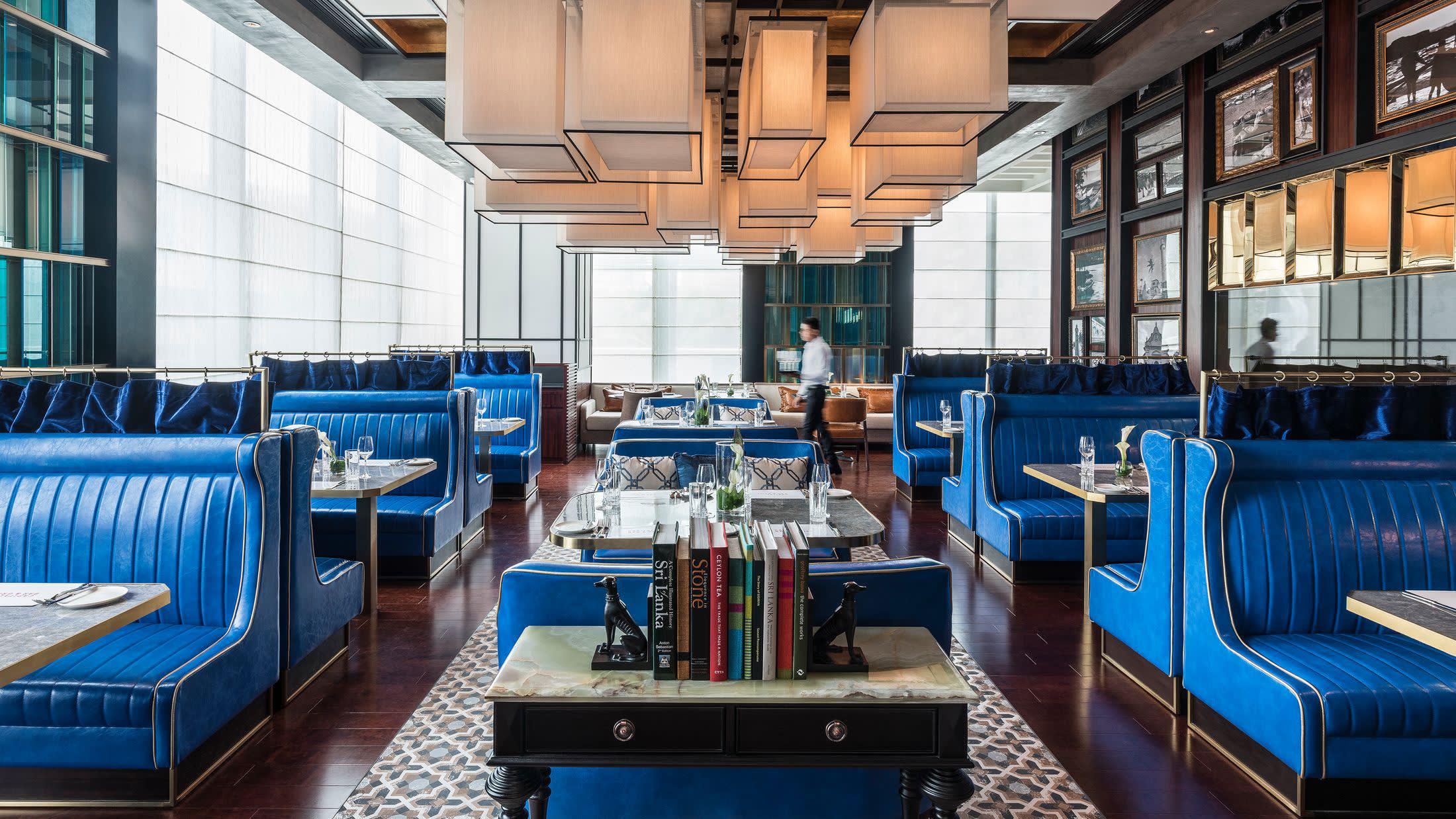 a room filled with furniture and a blue chair