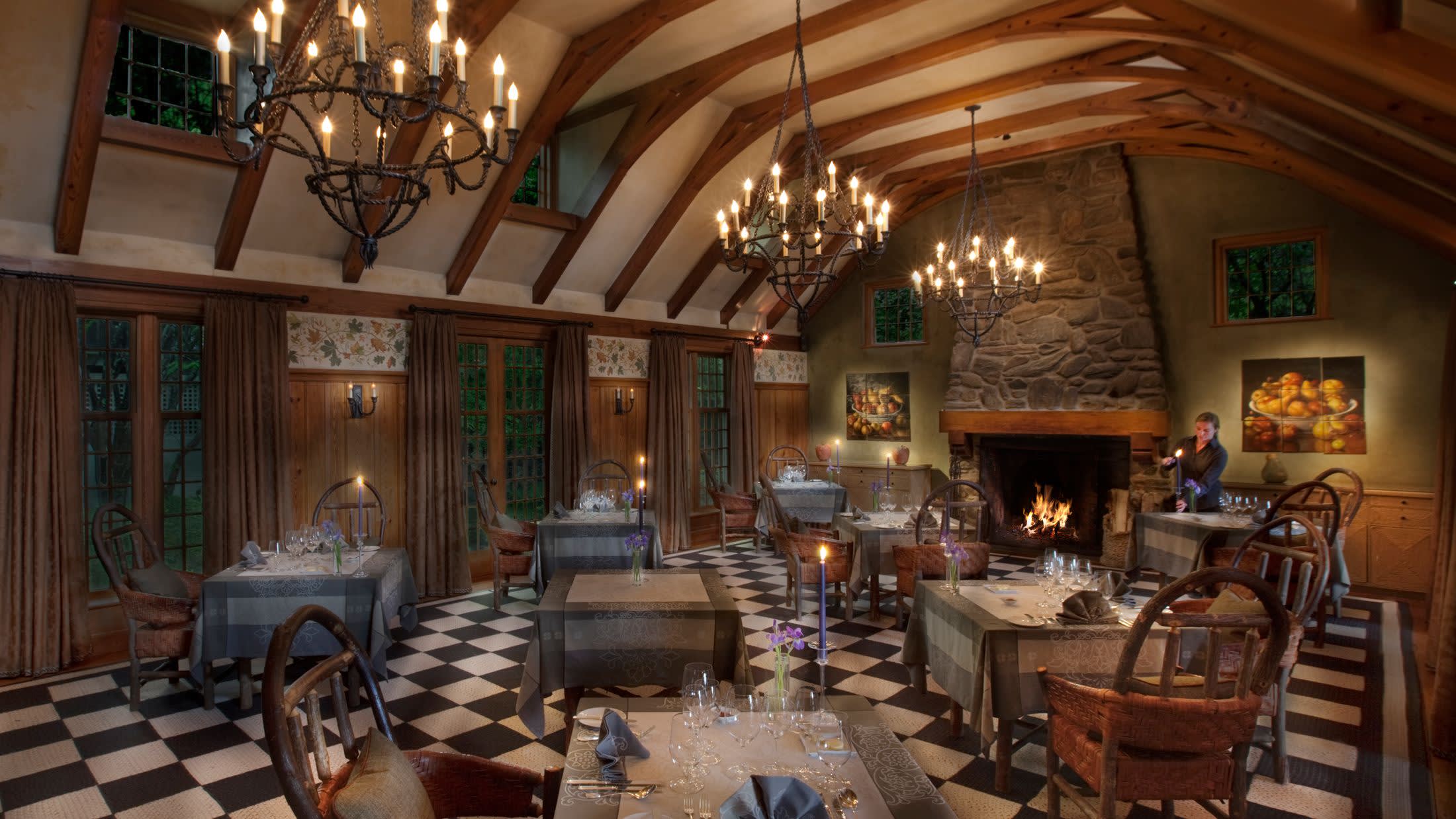 a living room filled with furniture and a fire place