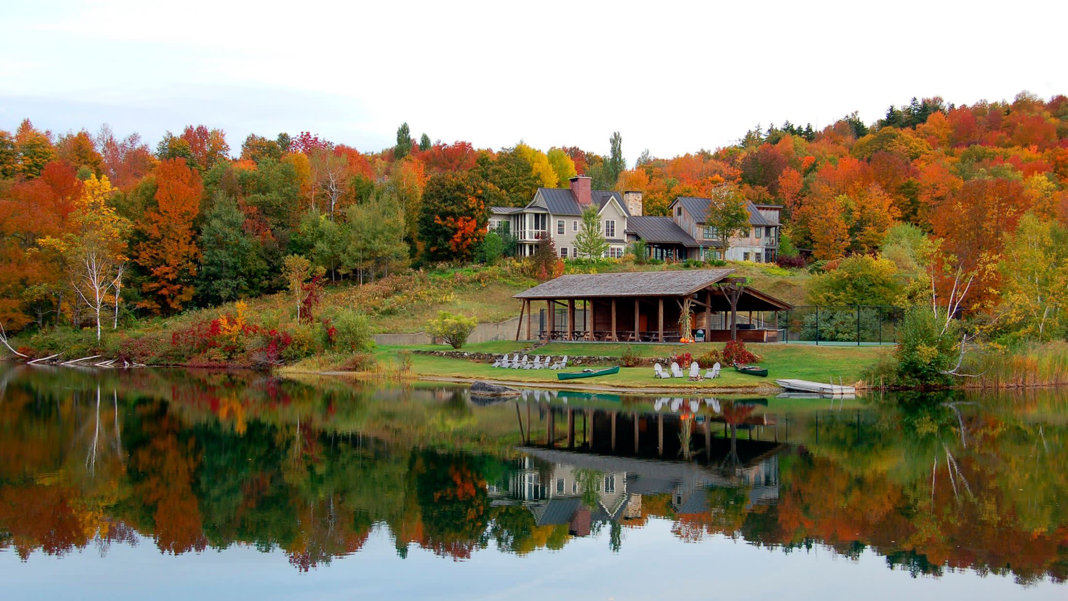 a train crossing a bridge over a body of water