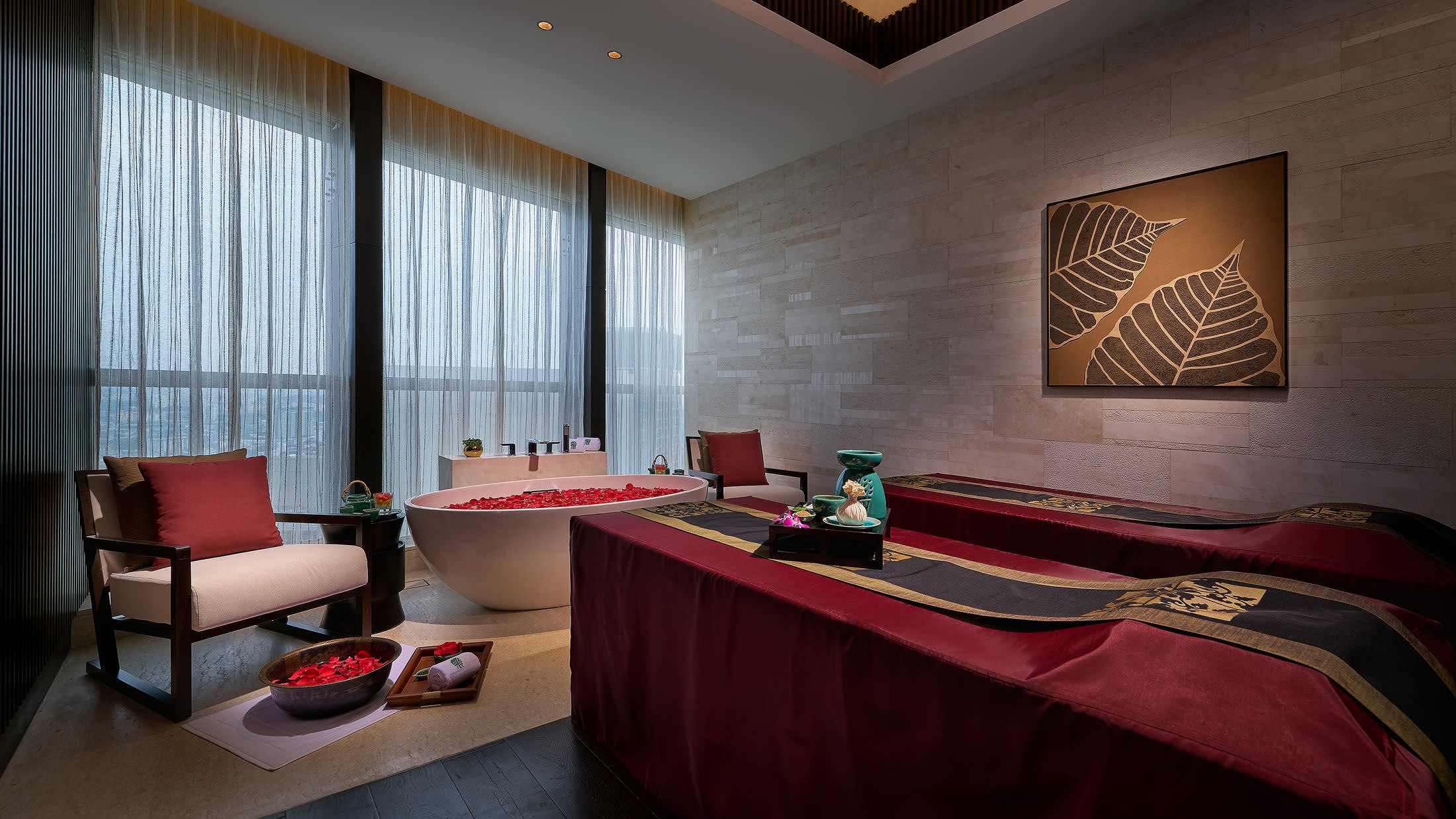 a living room filled with furniture and a large window