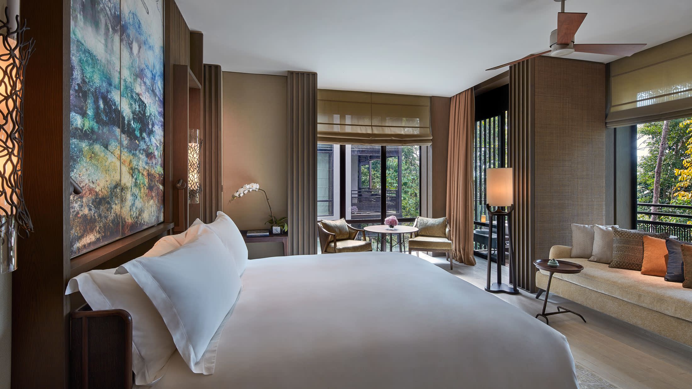 a bedroom with a large bed in a hotel room