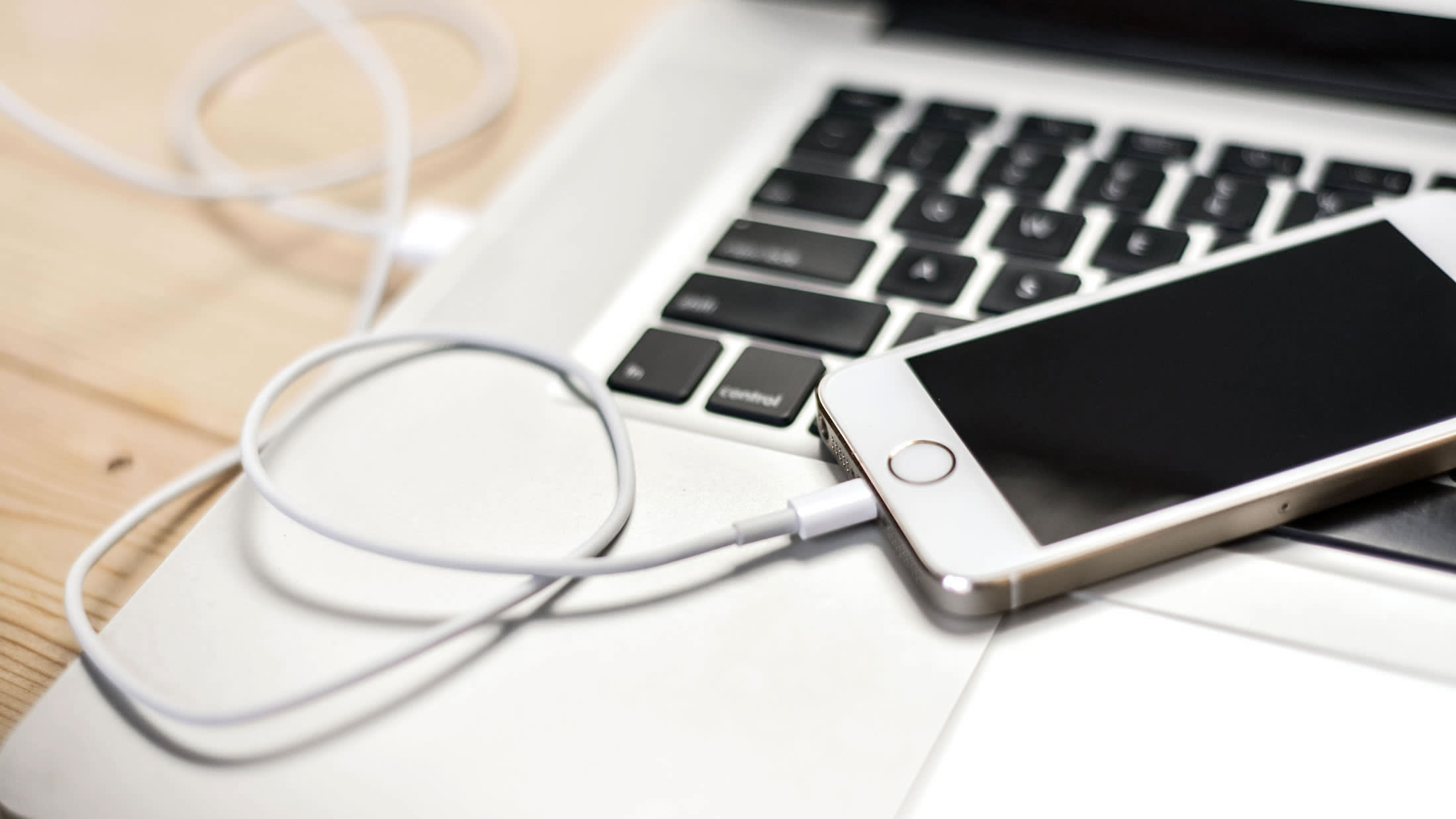 an open laptop computer sitting on top of a table