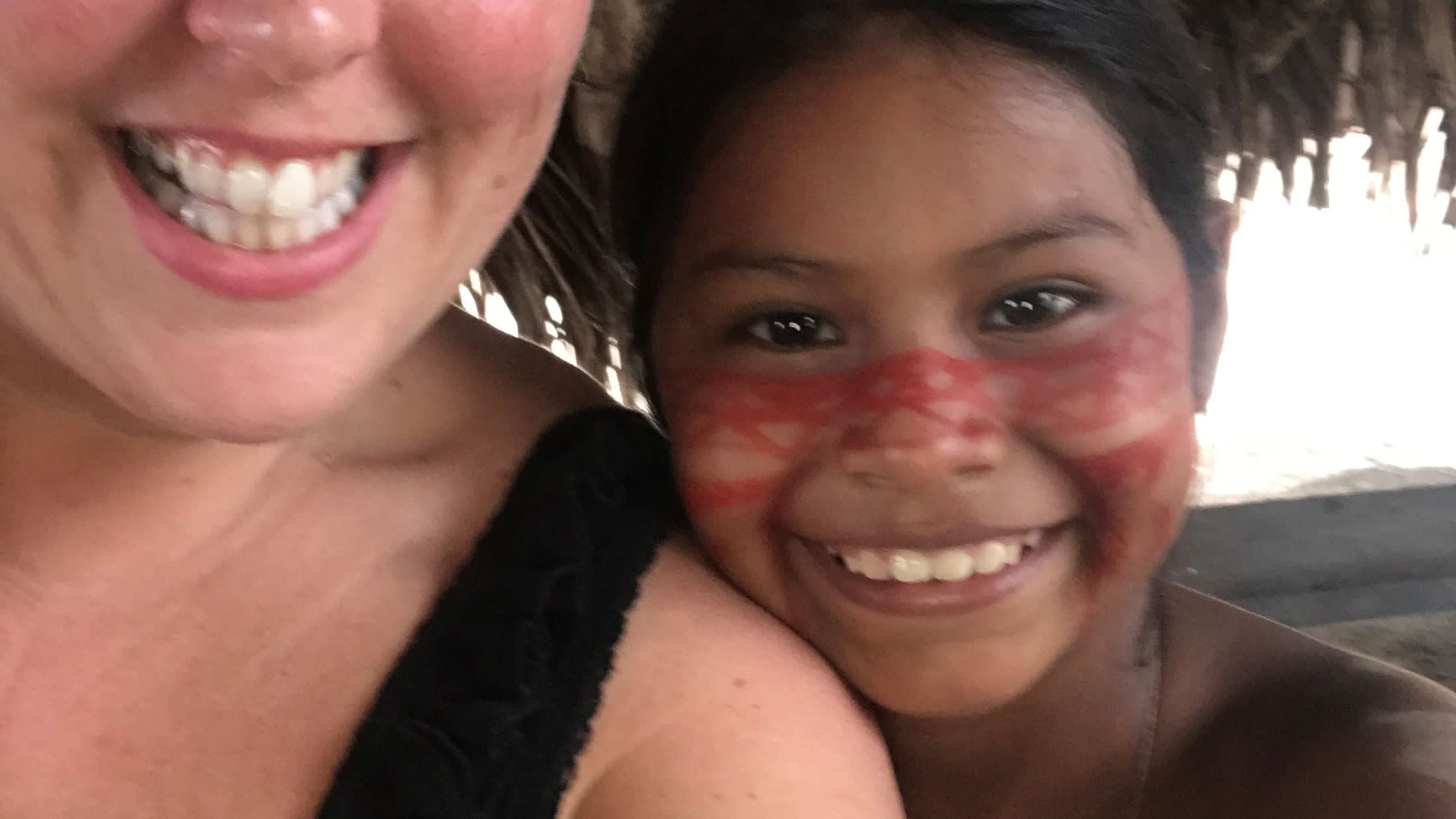 a close up of a woman smiling for the camera