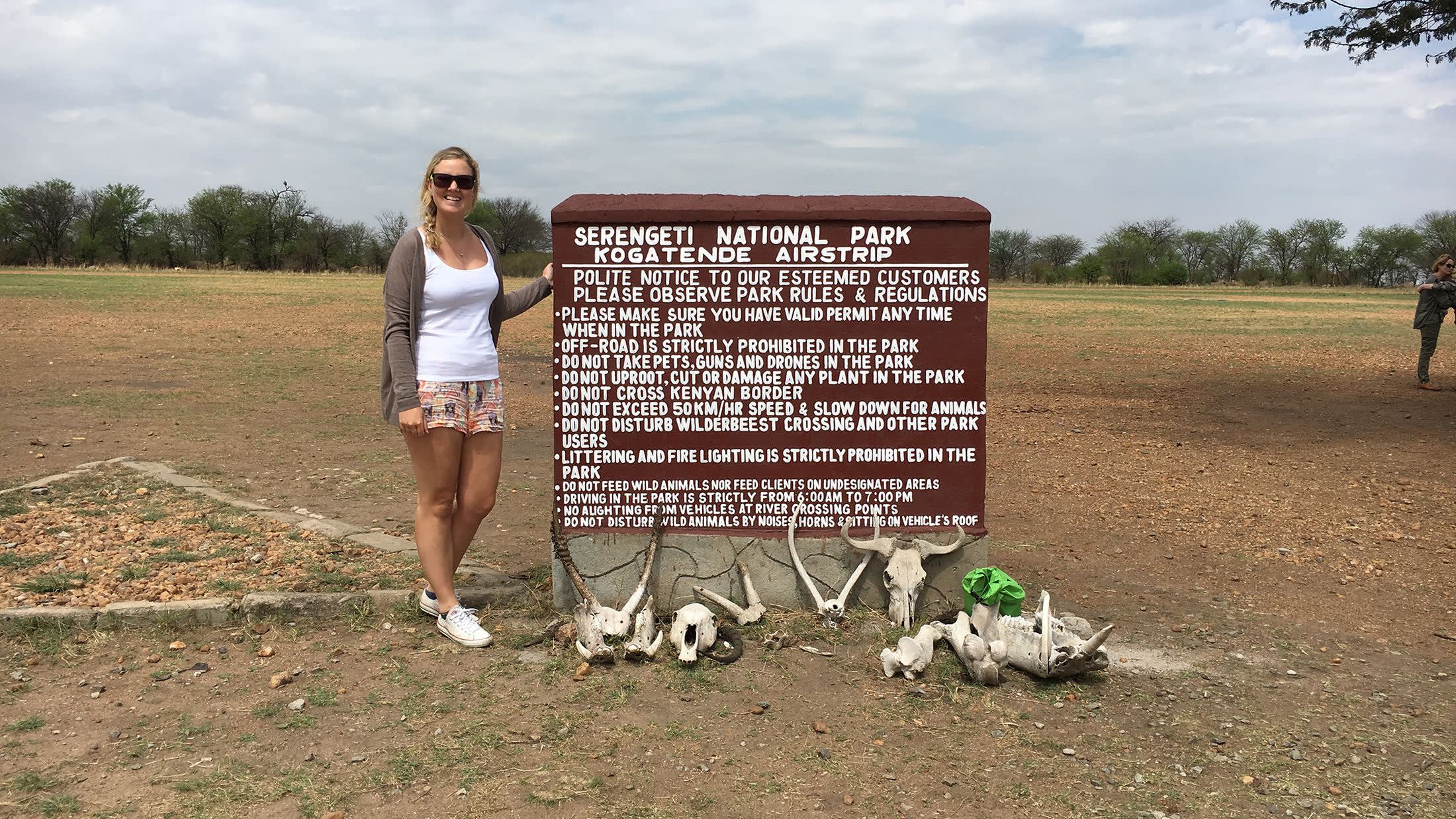a person standing in front of a sign