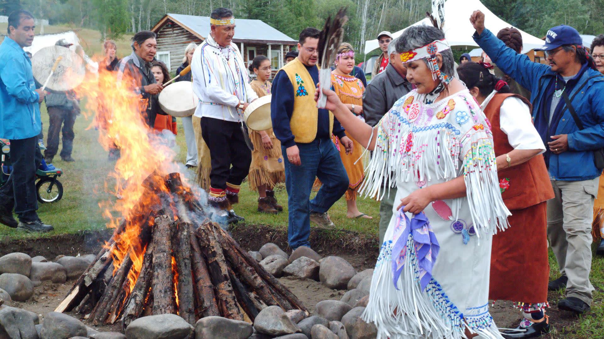 a group of people that are standing in the grass