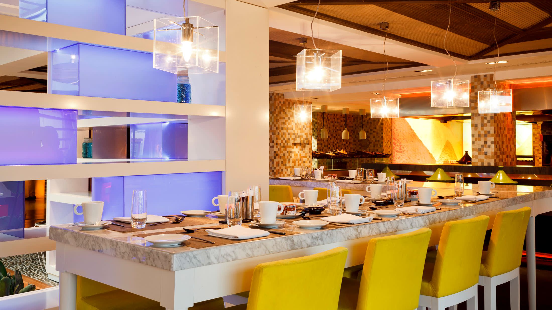 a kitchen with a table in a restaurant